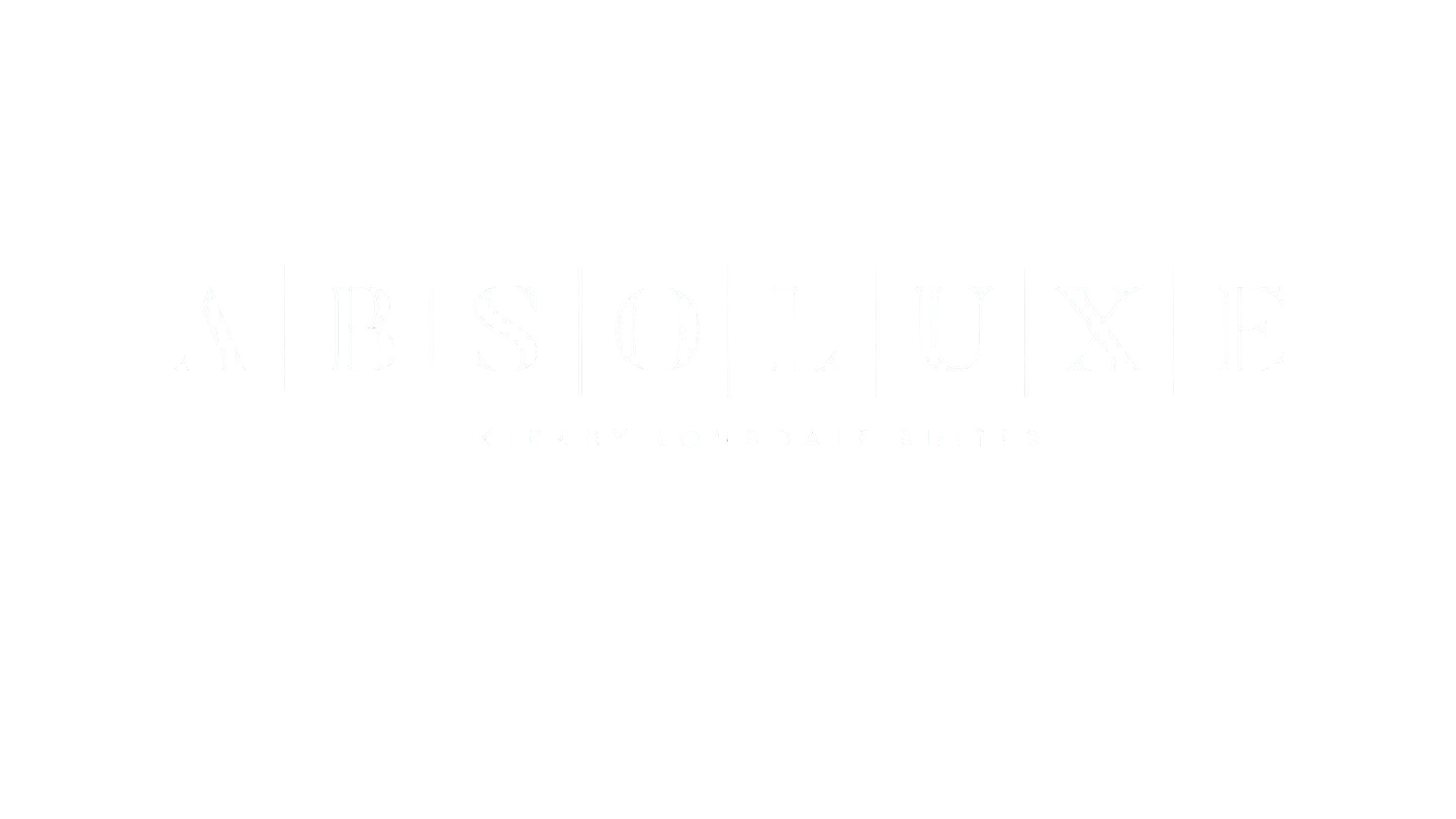 Black background with white text that reads 'ABSOLUXE' and 'KIRKBY LONSDALE SUITES' underneath.