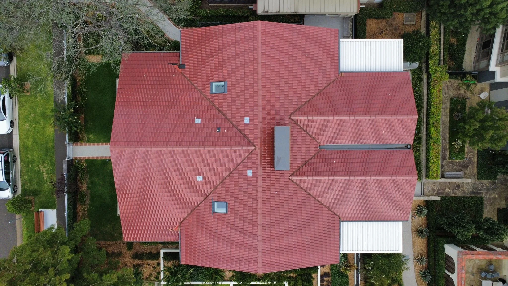 Sydney NSW Aerial view of completed red tile roof replacement on residential home