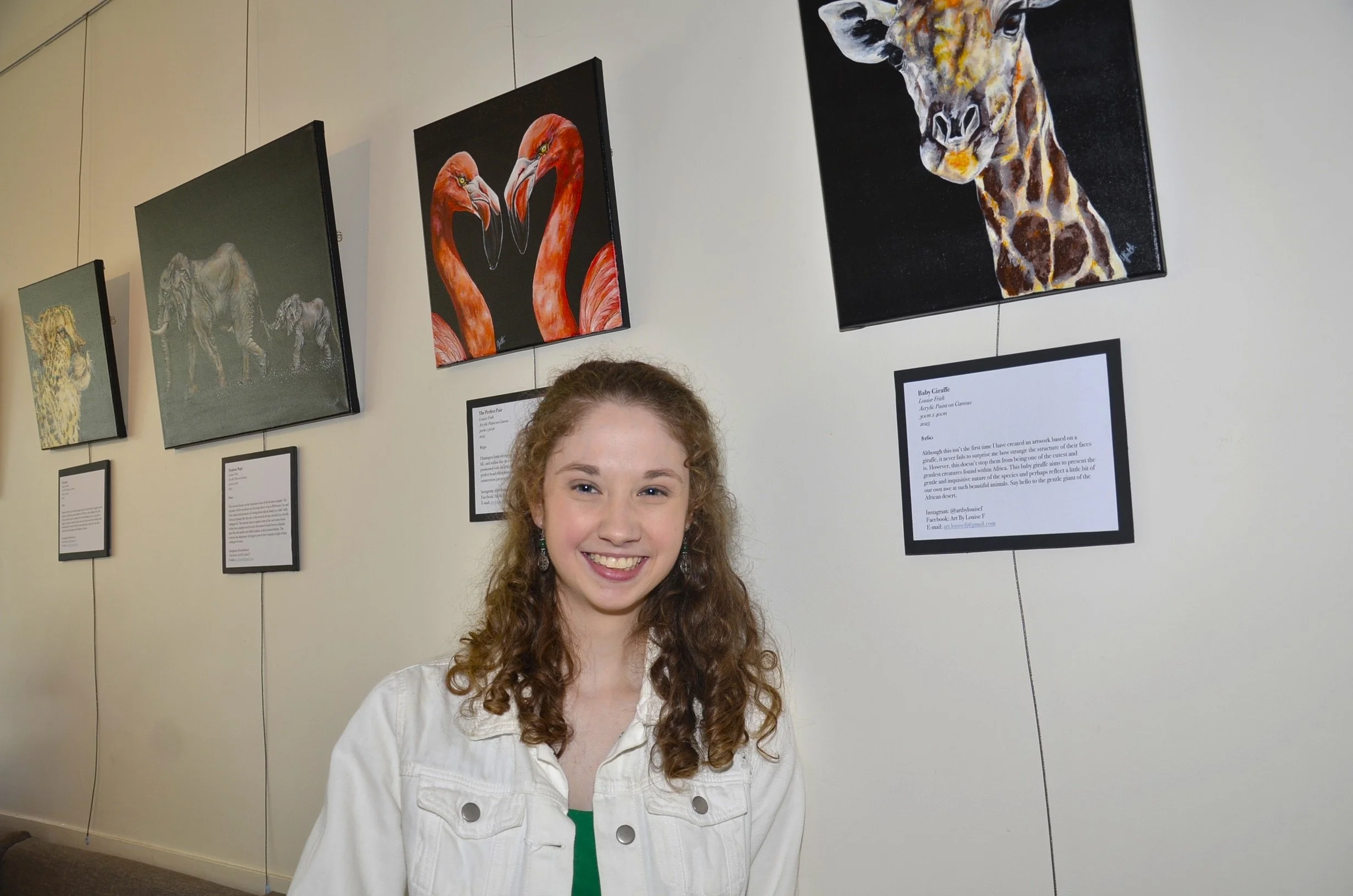 Ballarat based artist Louise Frith standing in front of her 2025 exhibition 'Step into Africa.' Louise Frith is an artist based in Ballarat, Victoria, Australia.