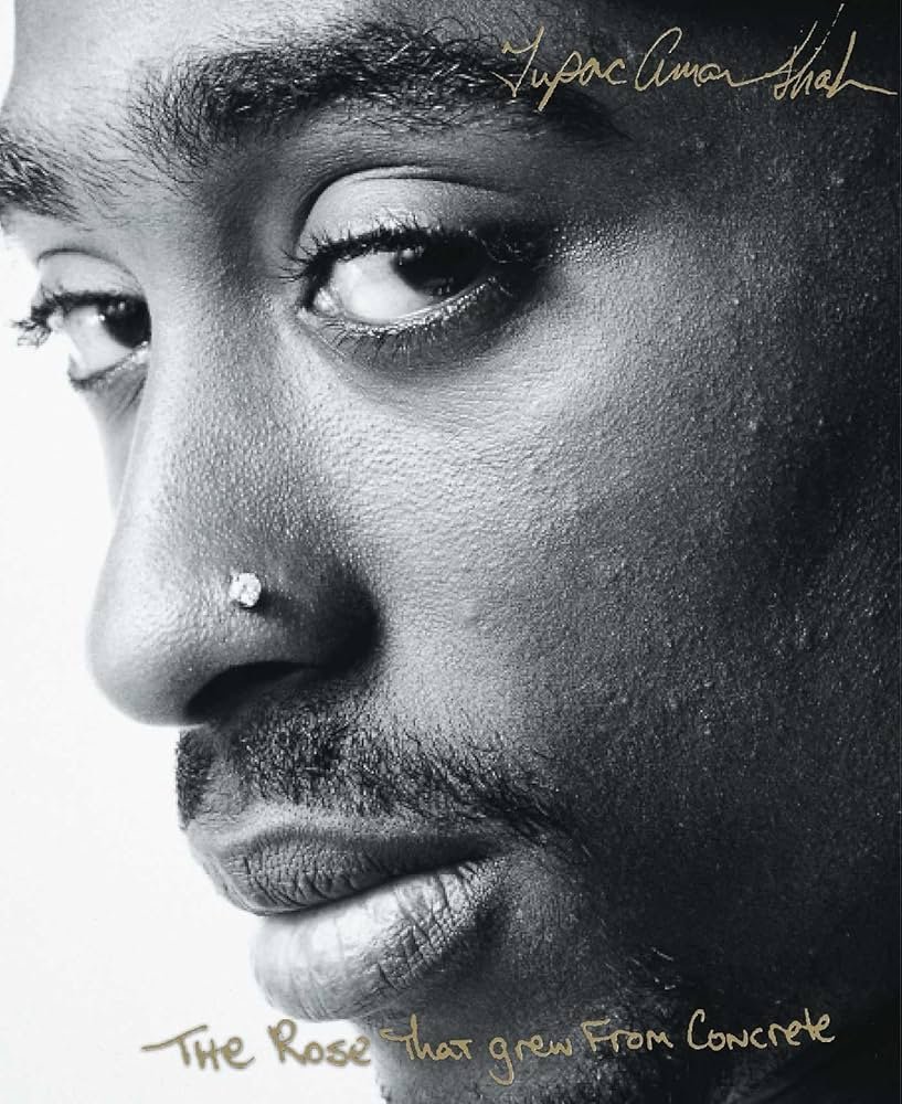 Book cover for "The Rose that Grew From Concrete" by Tupac Shakur it is a close-up image on Tupac's face.