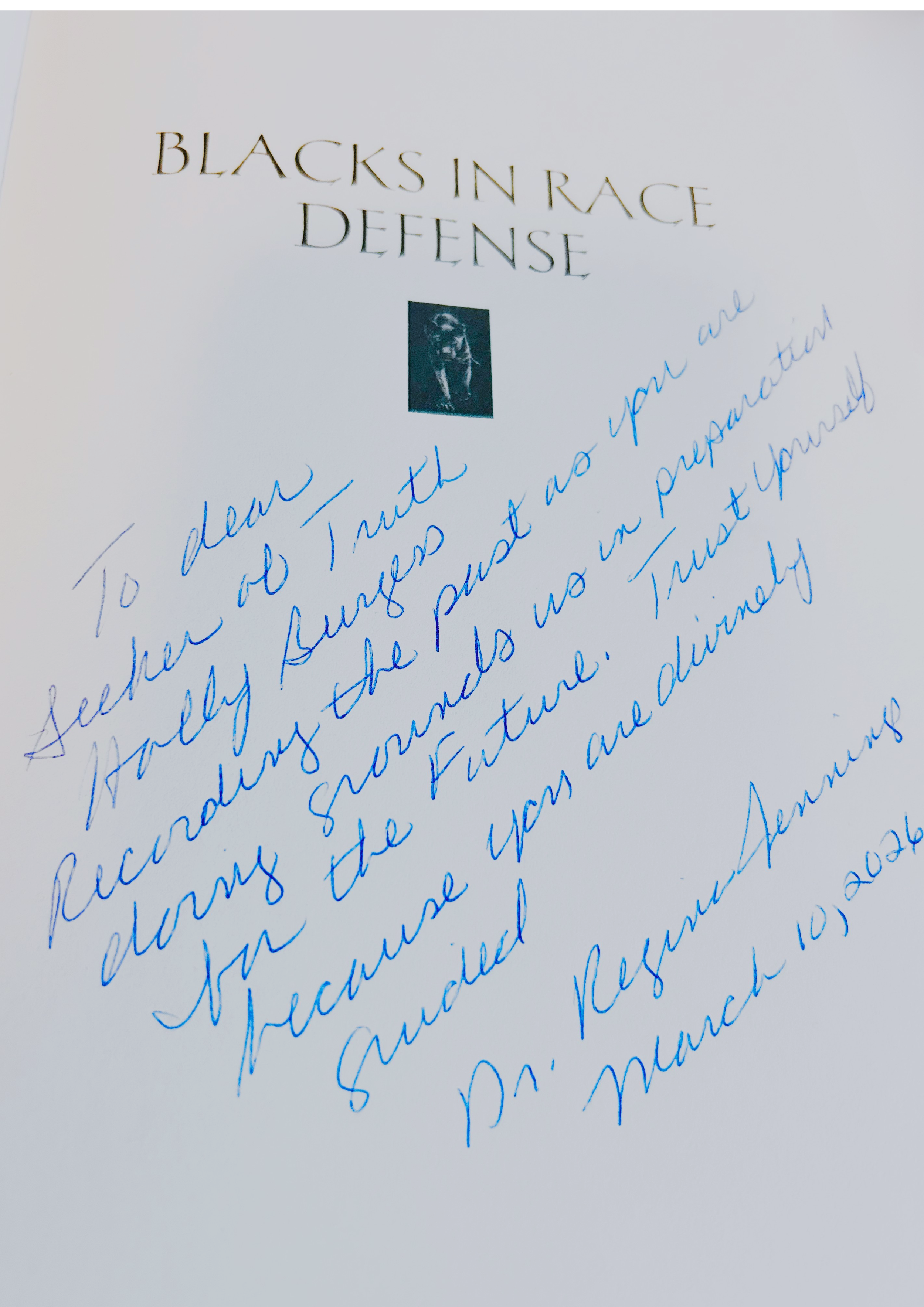 An autograph copy of Regina Jennings's "Blacks in Race Defense: Killers and Cutthroats". She inscribes a long message to Holly Burgess encouraging her writing and calling her a truth seeker.