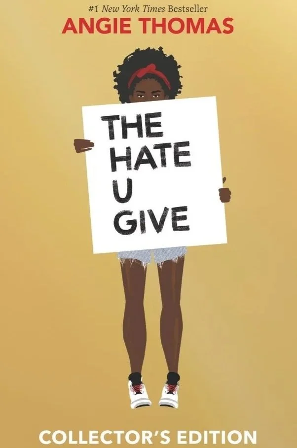 Book cover of 'The Hate U Give' by Angie Thomas featuring a girl with dark skin, curly hair with a red headband, holding a sign that says 'THE HATE U GIVE' against a yellow background.