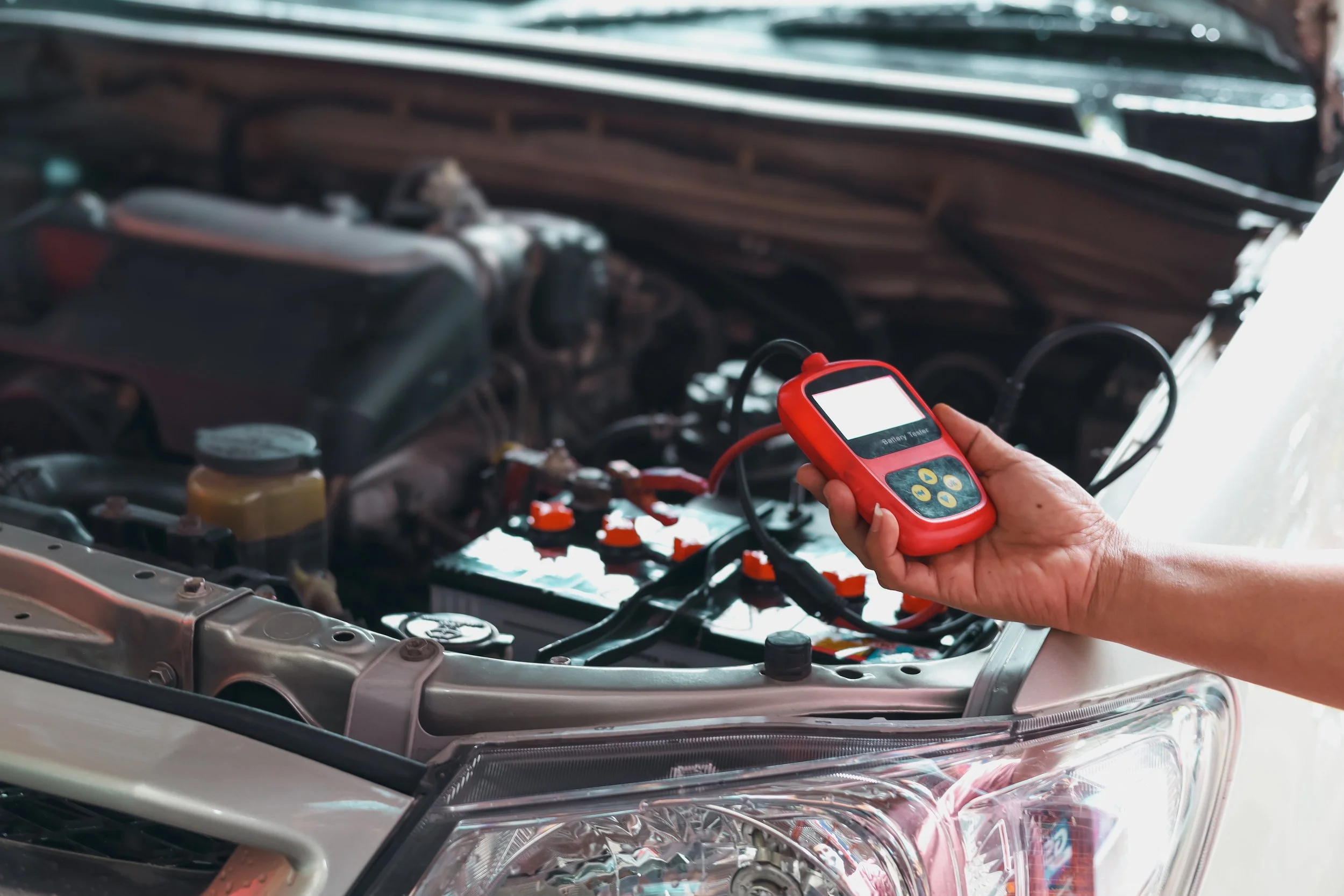 Free Engine Check light mechanic-using-car-battery-performance-meter