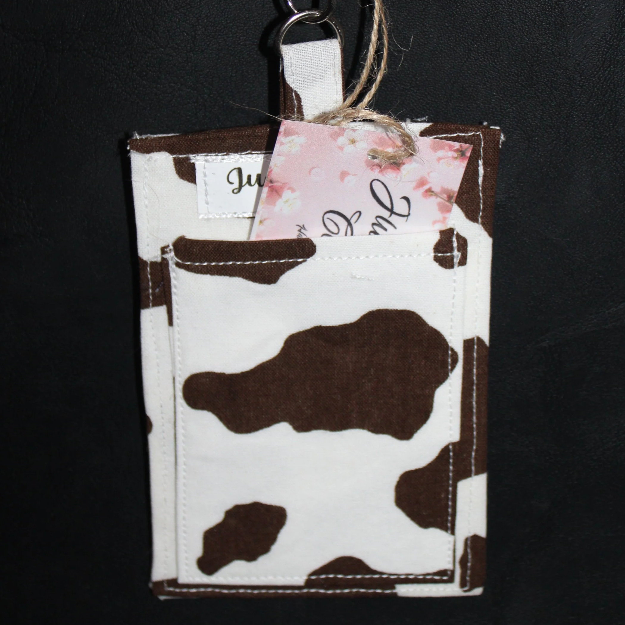 Back view of the Brown Cow Badge Holder with card partially inserted showing the slip pocket.