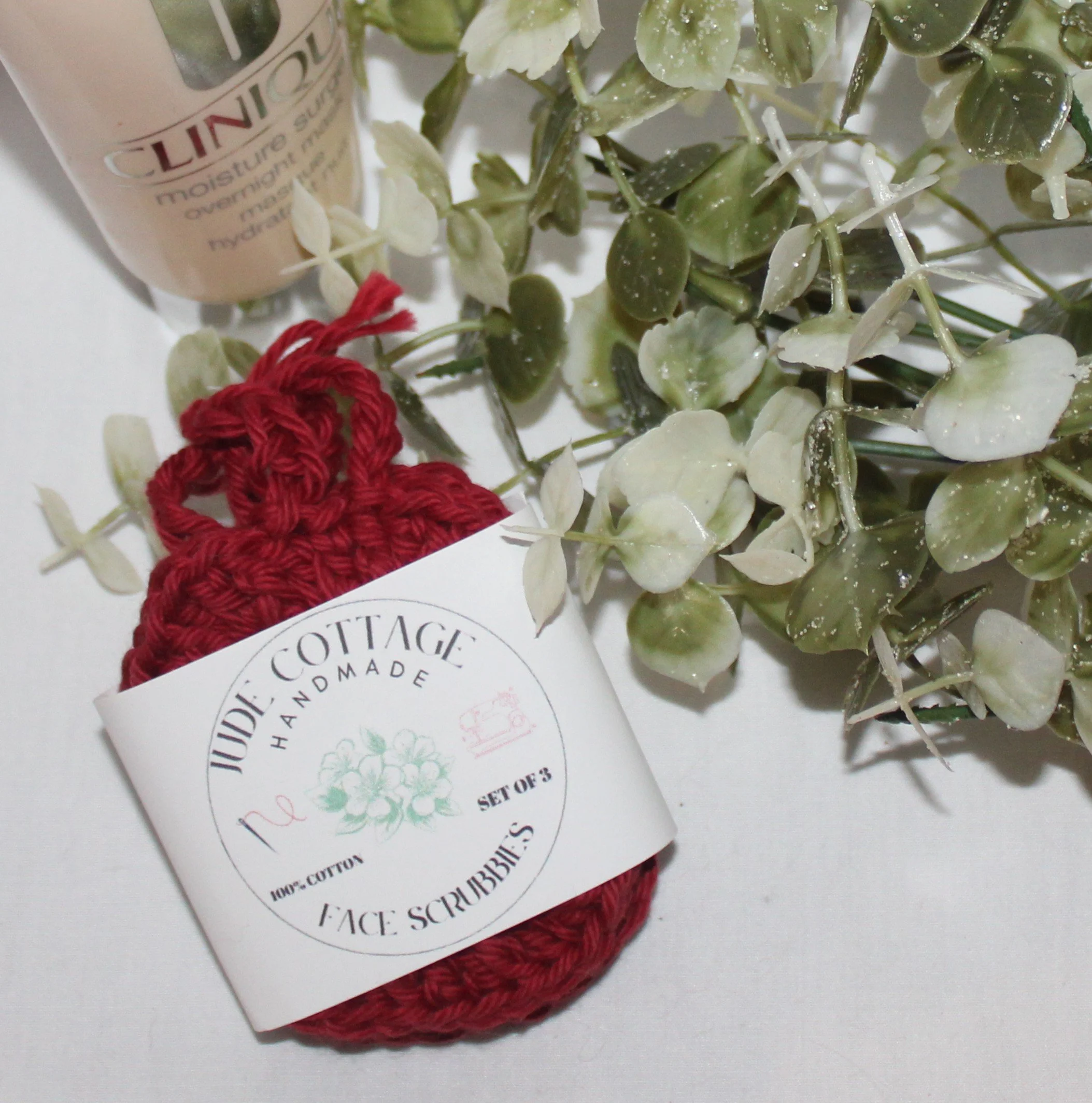 Set of handmade crochet facial pads in soft yarn, reusable and washable shown with label.