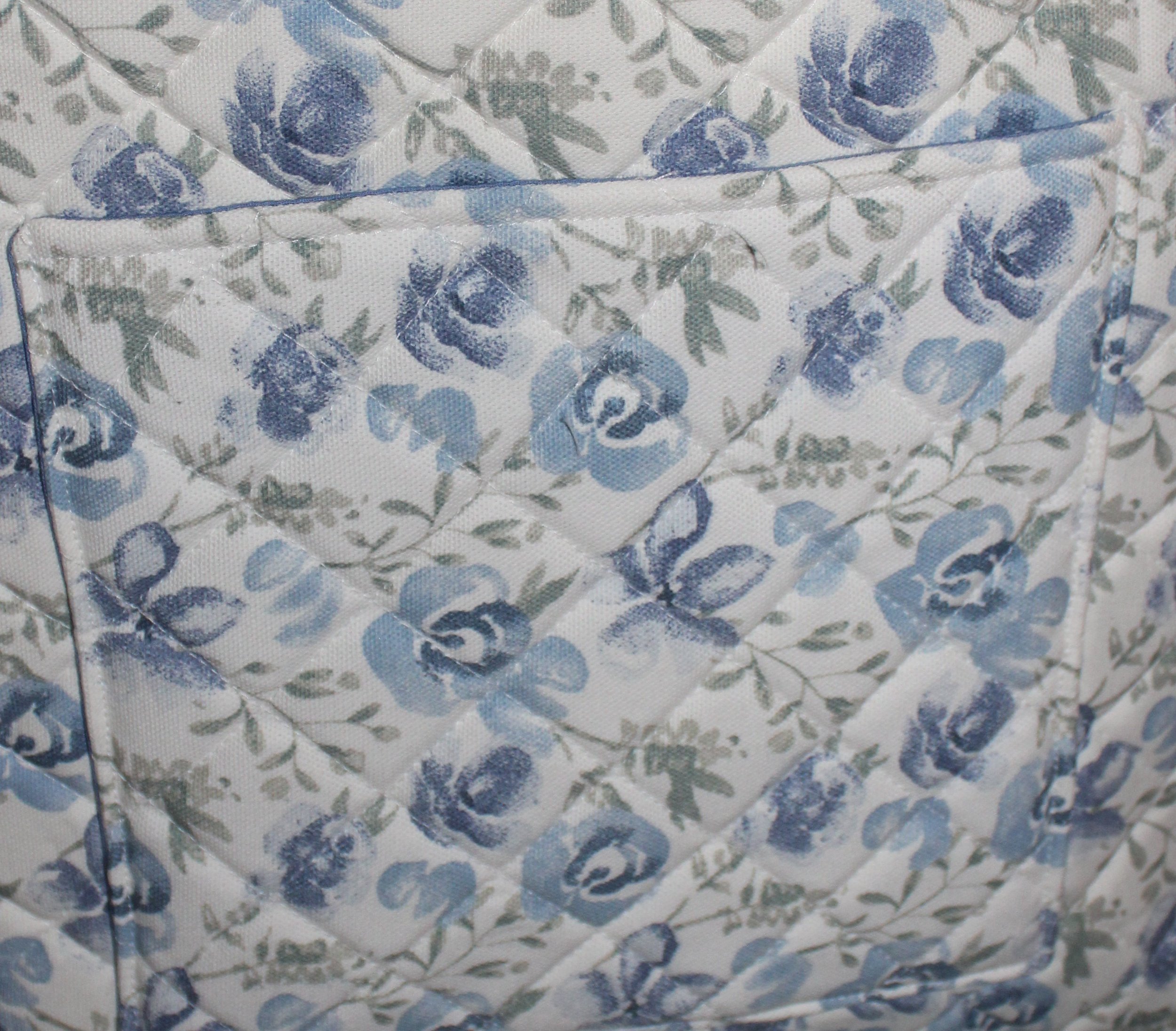 Up-close view of the back pocket of the Elise quilted tote, along with the quilted pattern.