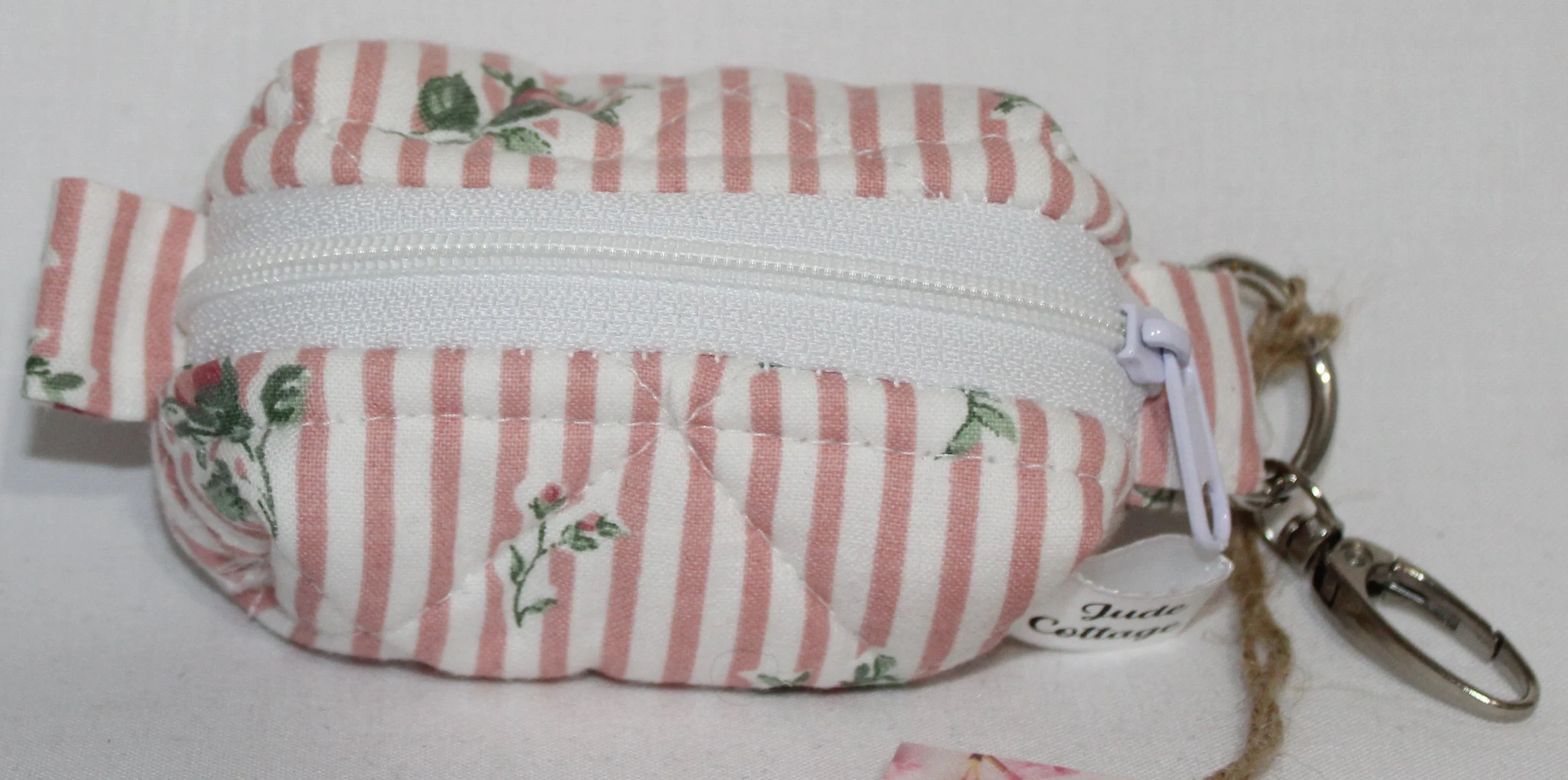 Front view of the Victoria bag charm featuring pink and white stripes with pink rose bud printed fabric.