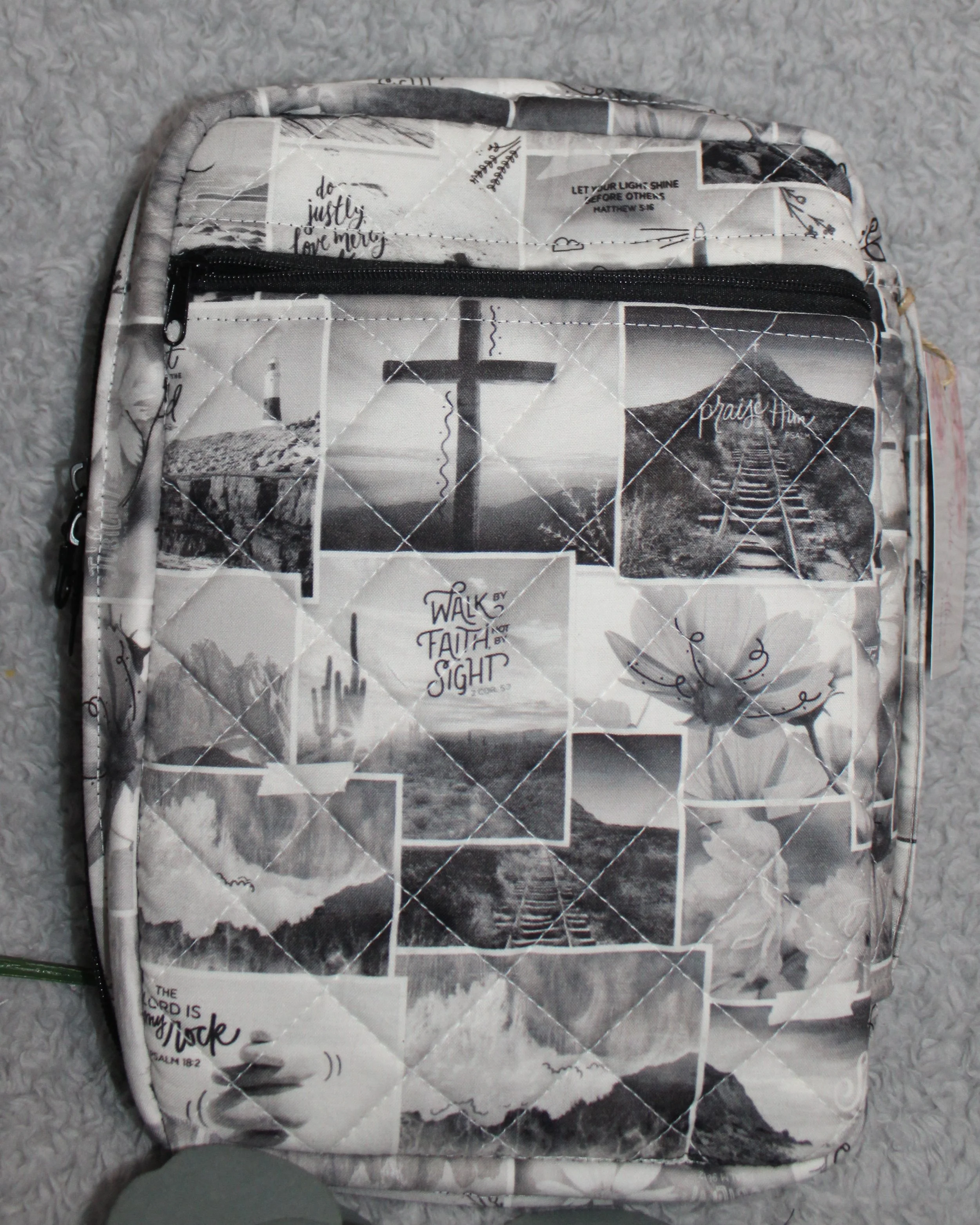 Back view of the Calvary Study Bible Case with monochrome inspirational text, showing the zippered pocket.