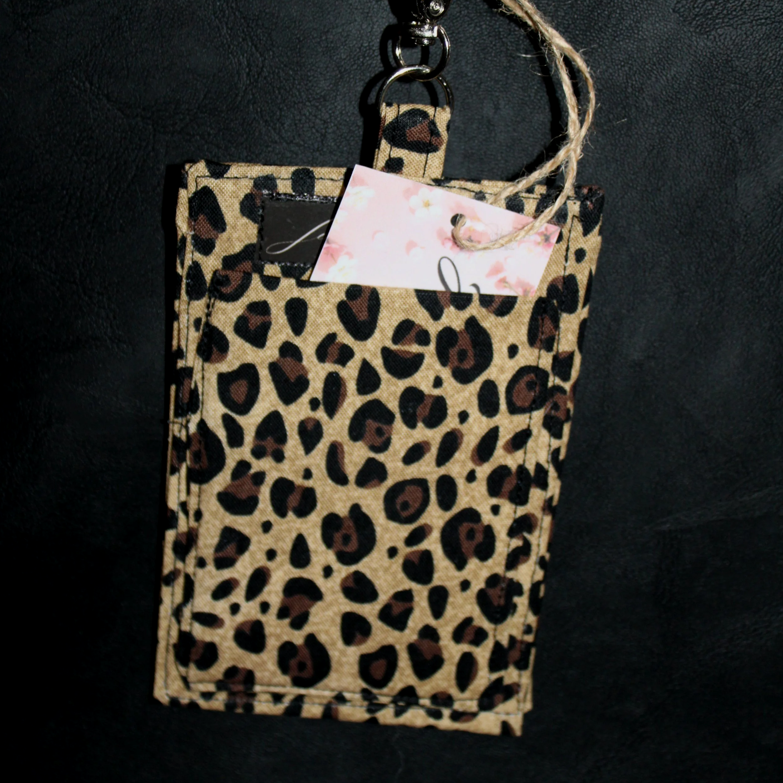 Back view of the Sahara Badge Holder shown with a card partially inserted to illustrate pocket.