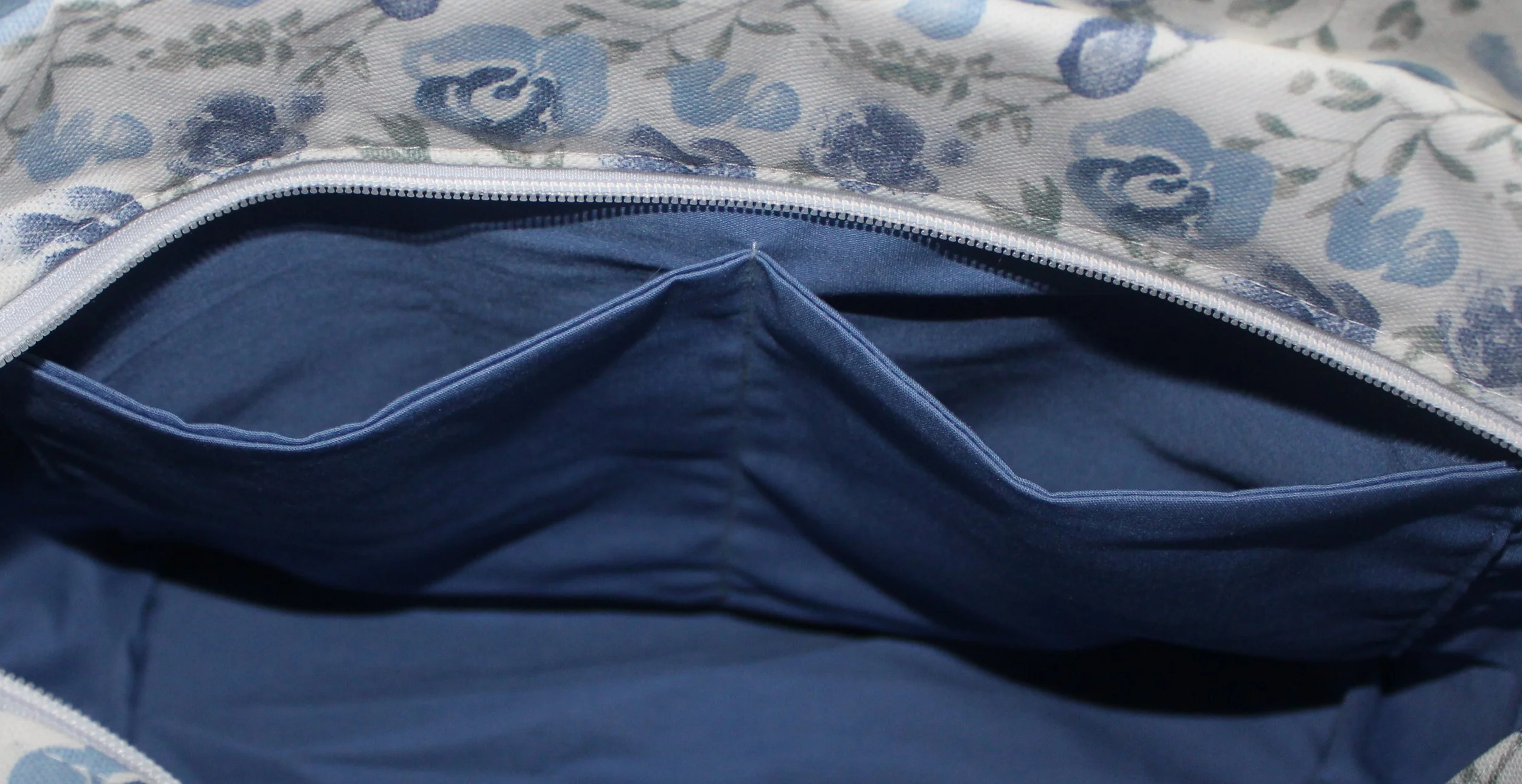 Interior view of the Elise quilted tote showing the two interior slip pockets.