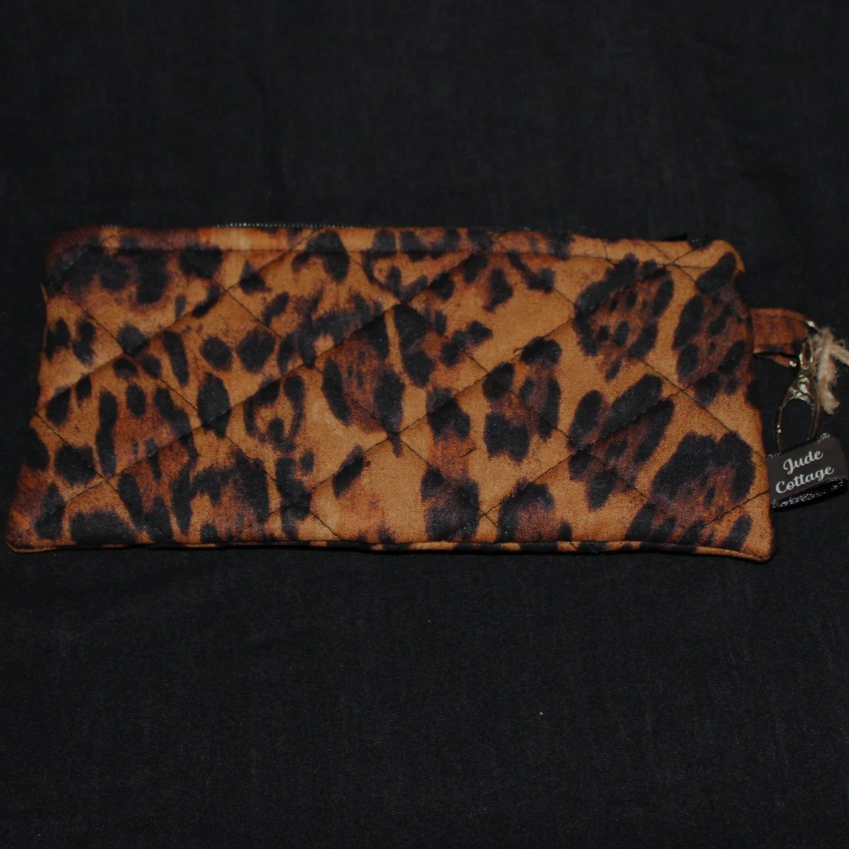 Front flat view of the Lyra Large Keychain Wallet featuring a large leopard print fabric.