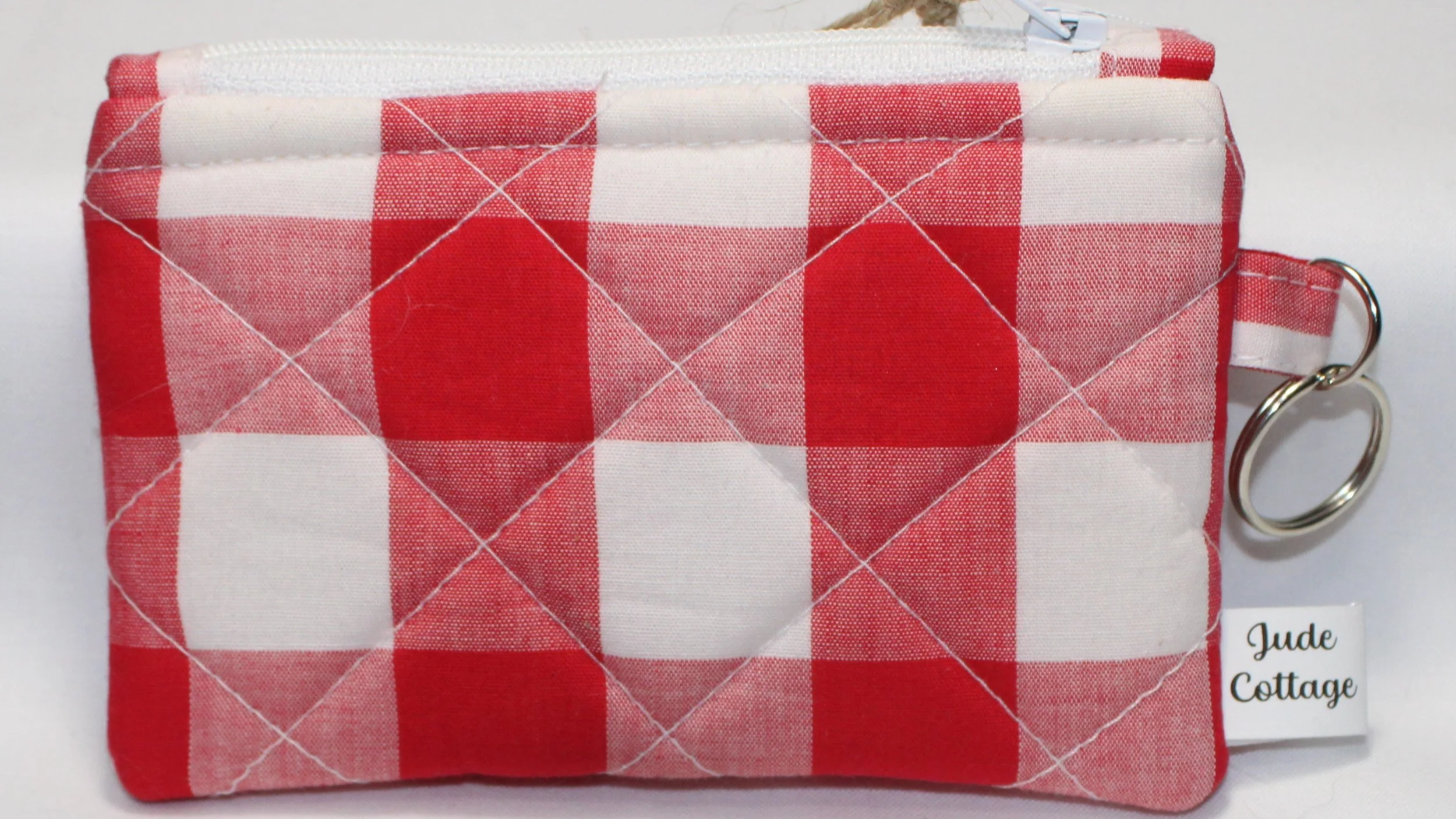 Quilted keychain wallet with bright modern pattern, zipper closure, and metal key ring.