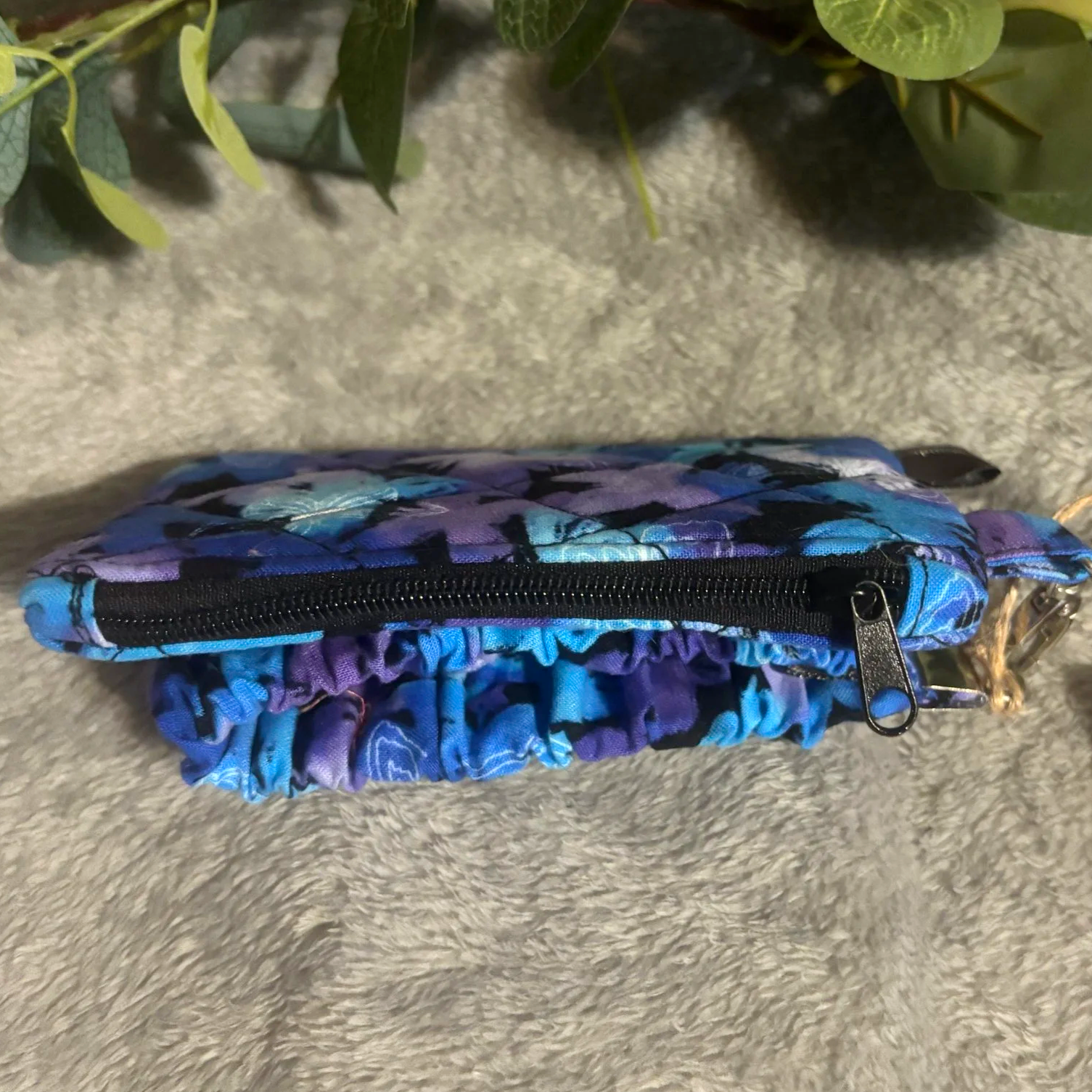 Closed top view of the Butterfly Mist Keychain Wallet Set showing the zip closure.