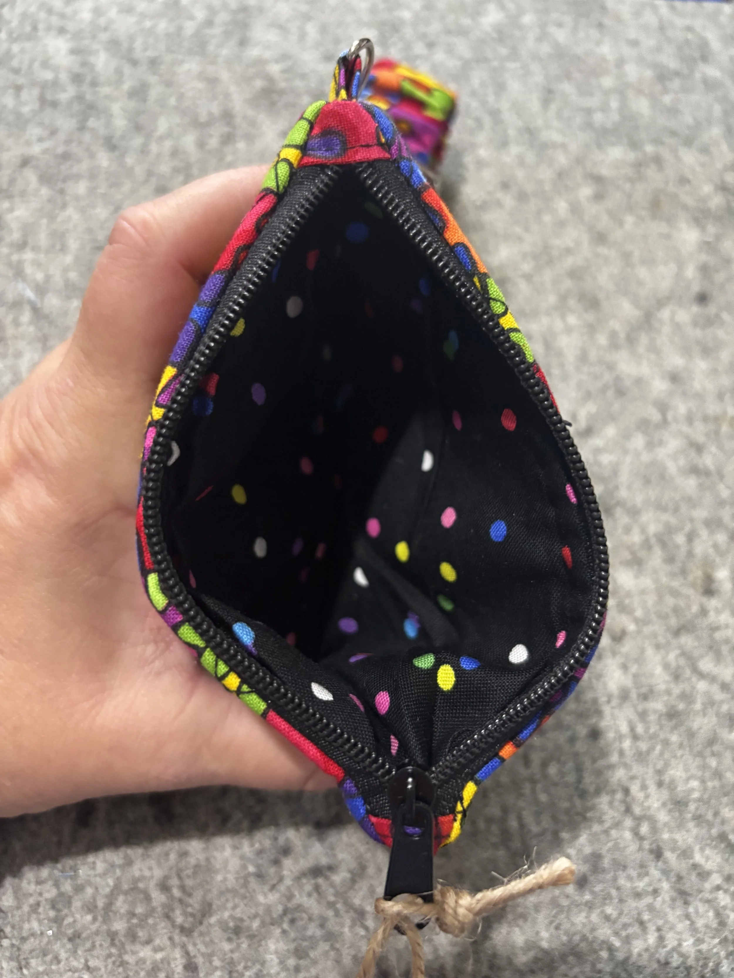 Interior view of the Autism Awareness Wallet showing black fabric with bright polka dots.