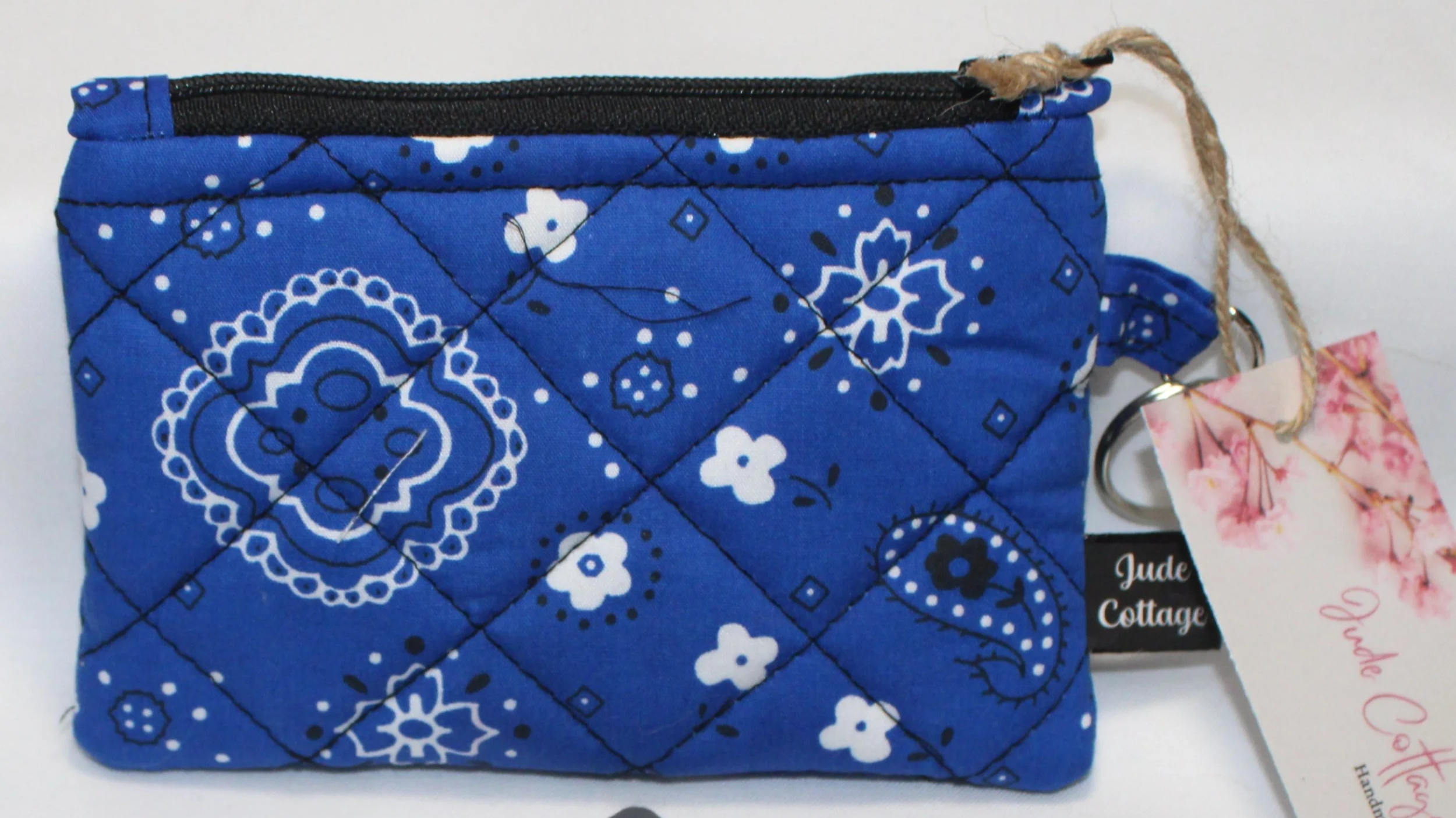 Blue bandana-pattern quilted keychain wallet with zipper closure and metal key ring.