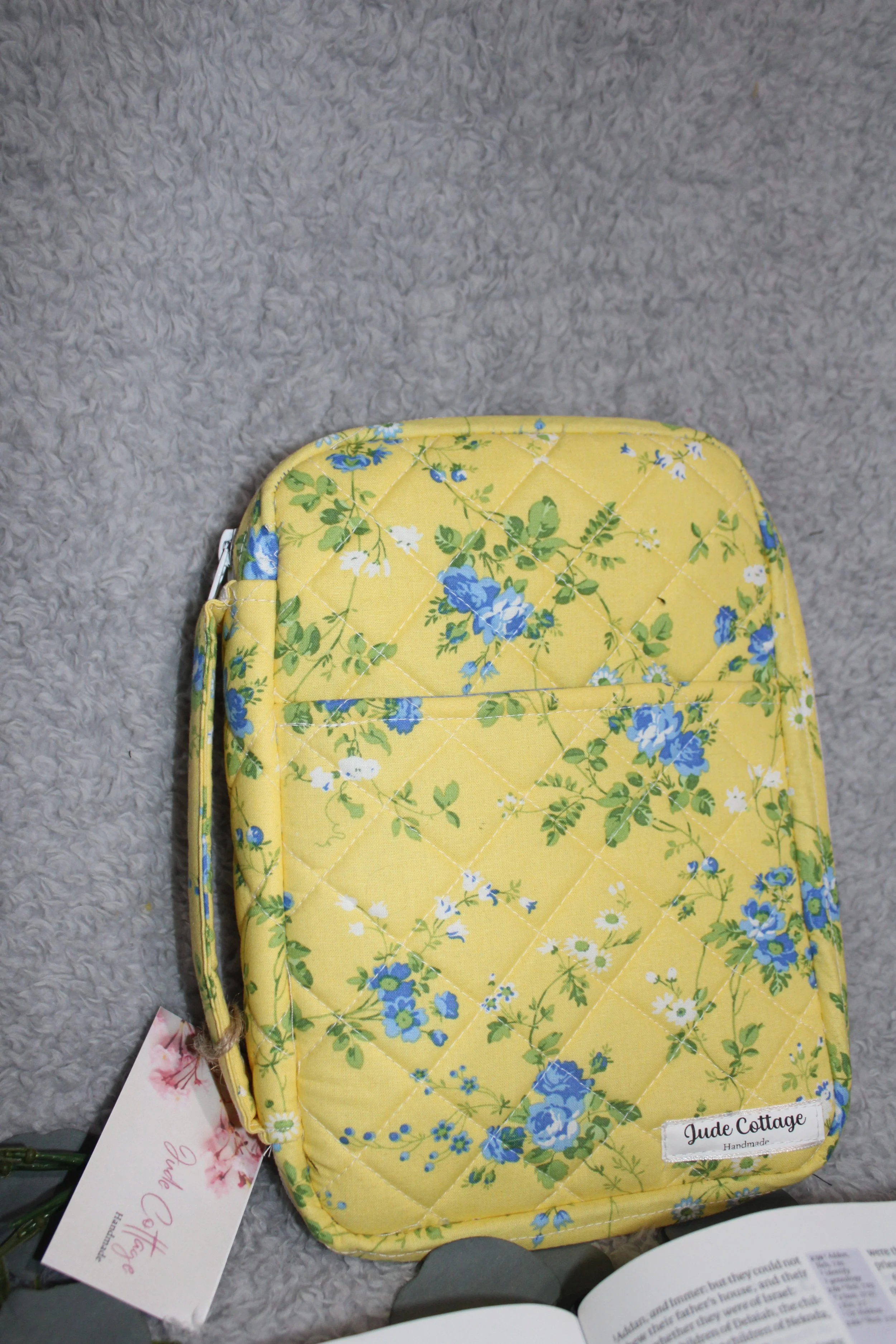 Close-up view of the front cover of the Flora Study Bible Case, showing the front slip pocket and handle.