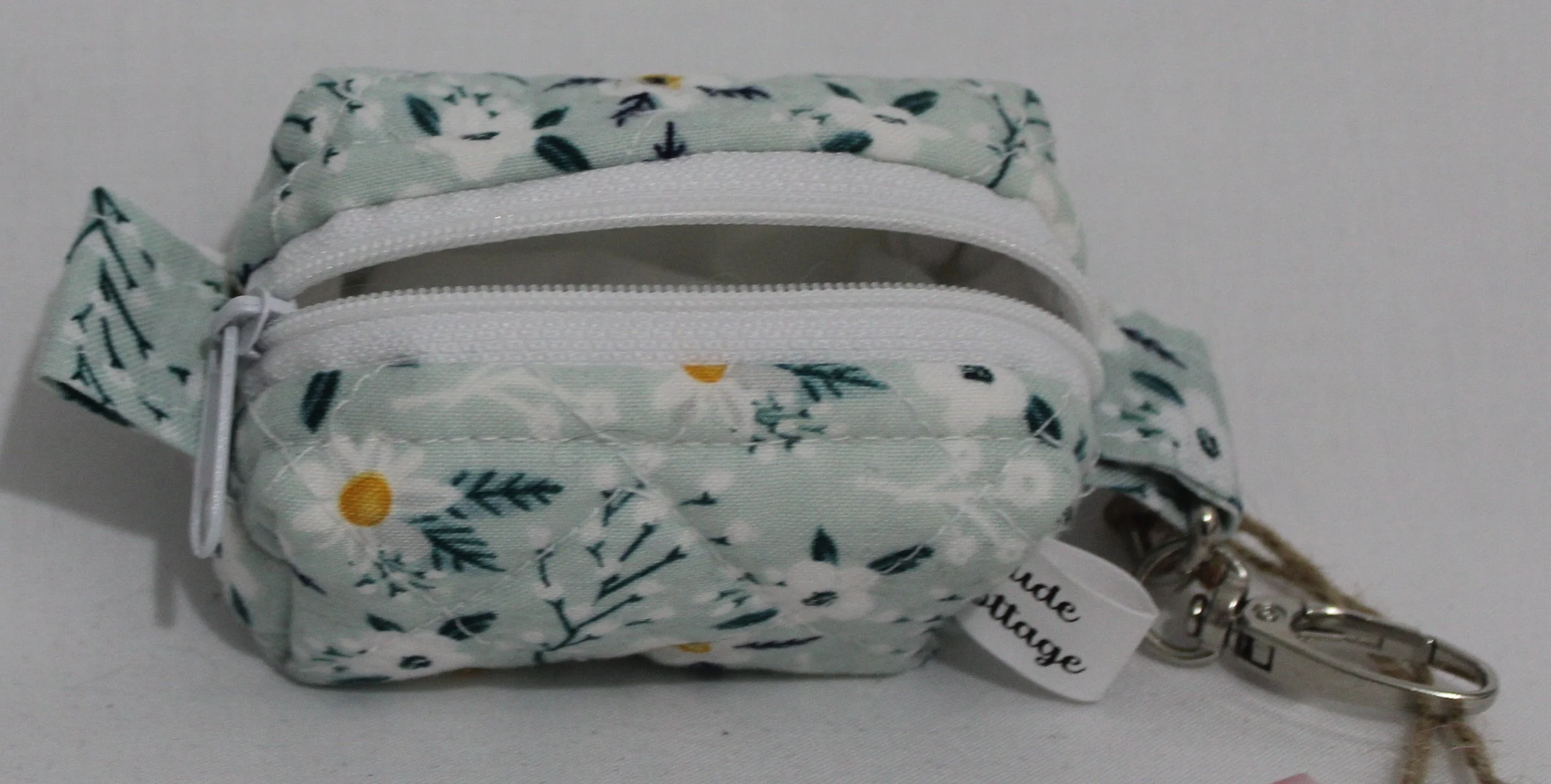Top open view of the Vera Bag Charm showing white lining.
