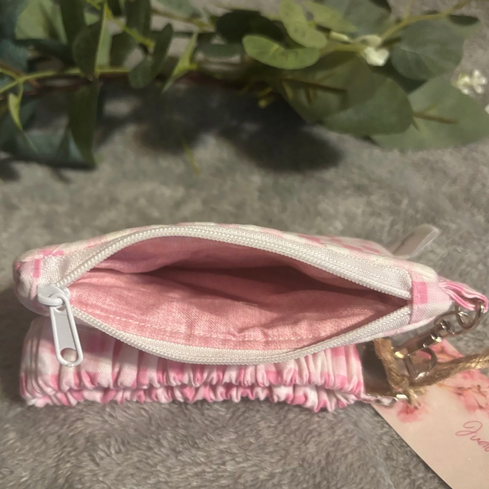 Top open view of the Annabelle keychain wallet showing pink linen print interior lining.