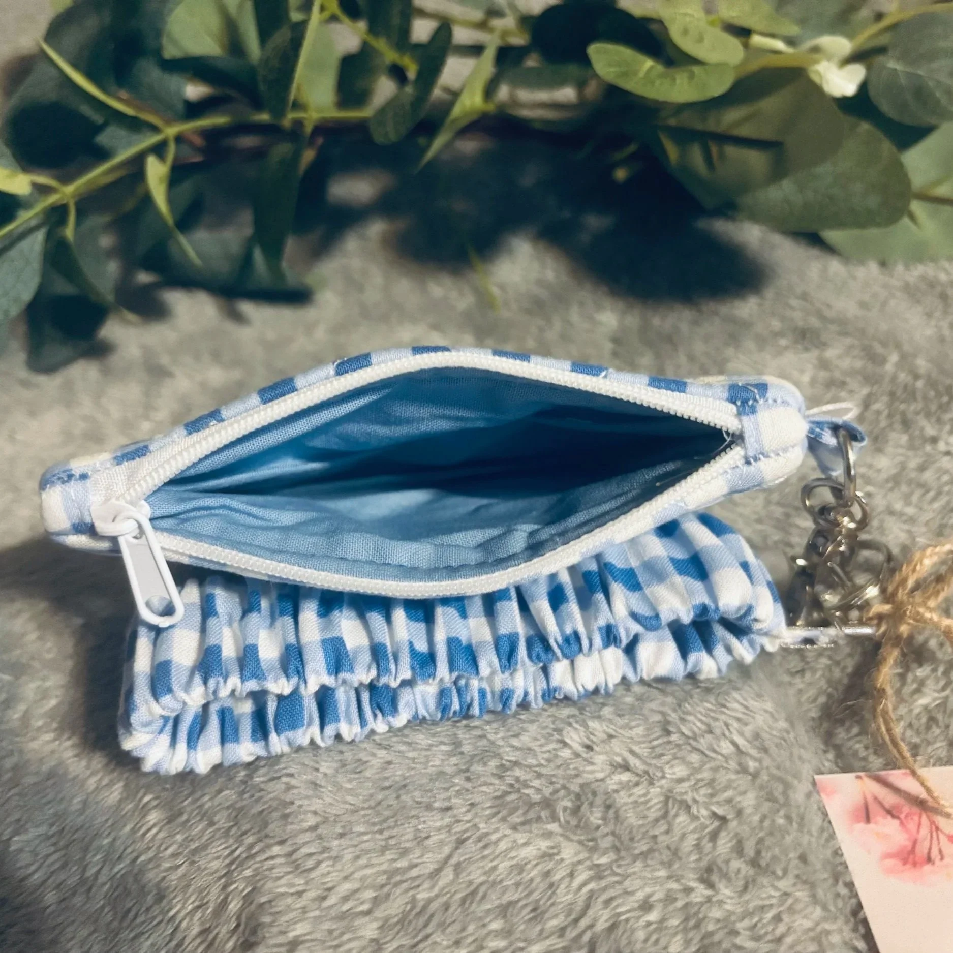 Open top view of the Annabeth Keychain wallet showing blue interior lining.