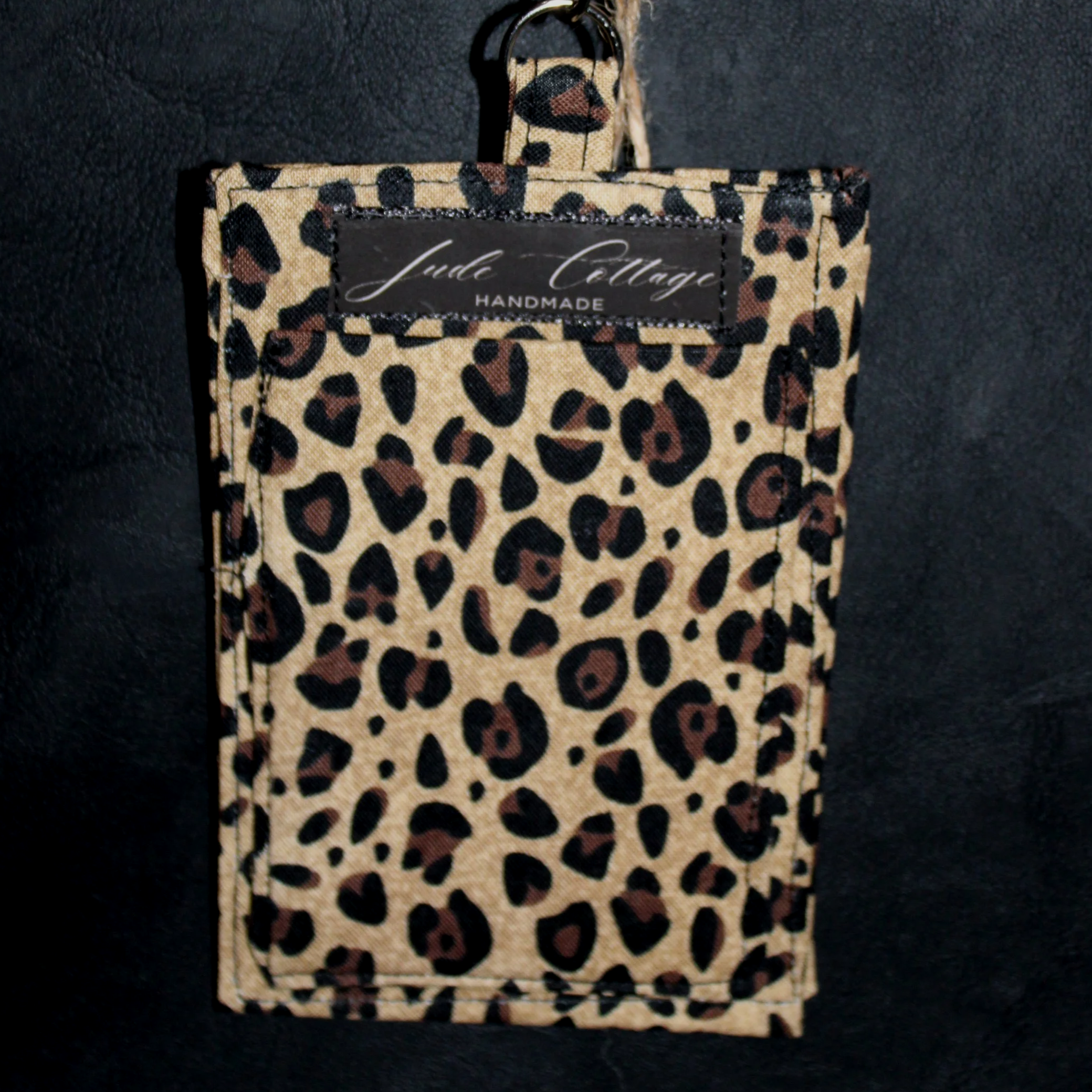 Back empty view of the Sahara Badge Holder featuring a slip pocket for money, cards, or other essentials.