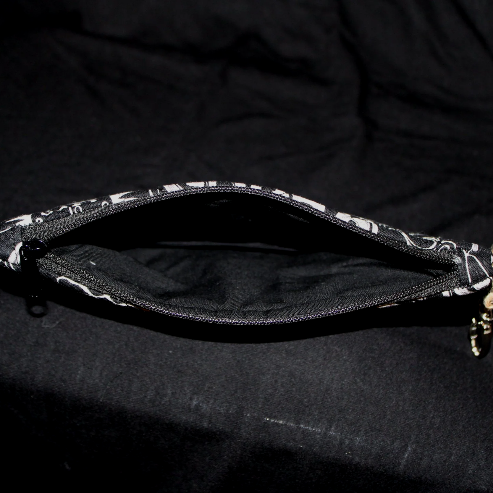 Open top view of the King of Kings Large Keychain Wallet showing the black zip and lining.