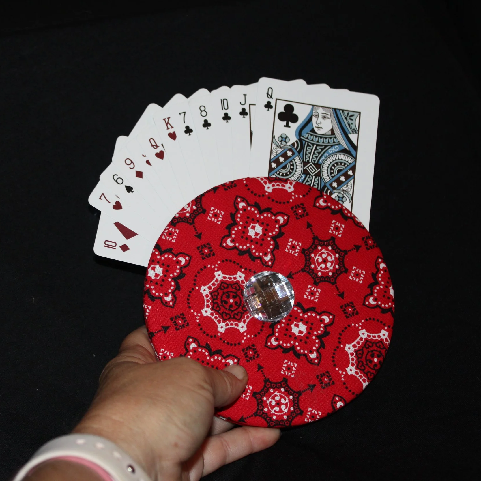 Front view of the Red Diamond Card Holder featuring red bandana inspired fabric, with cards inserted to show usage showing a demonstration of it being held.