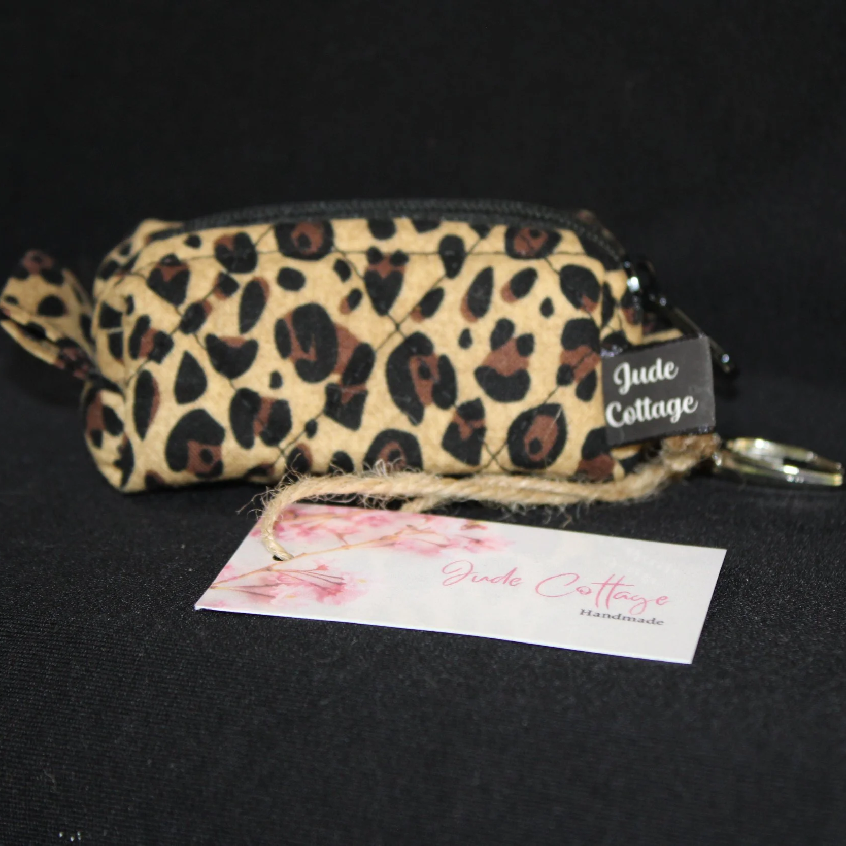Front view of the Sahara Bag Charm featuring cheetah print fabric.