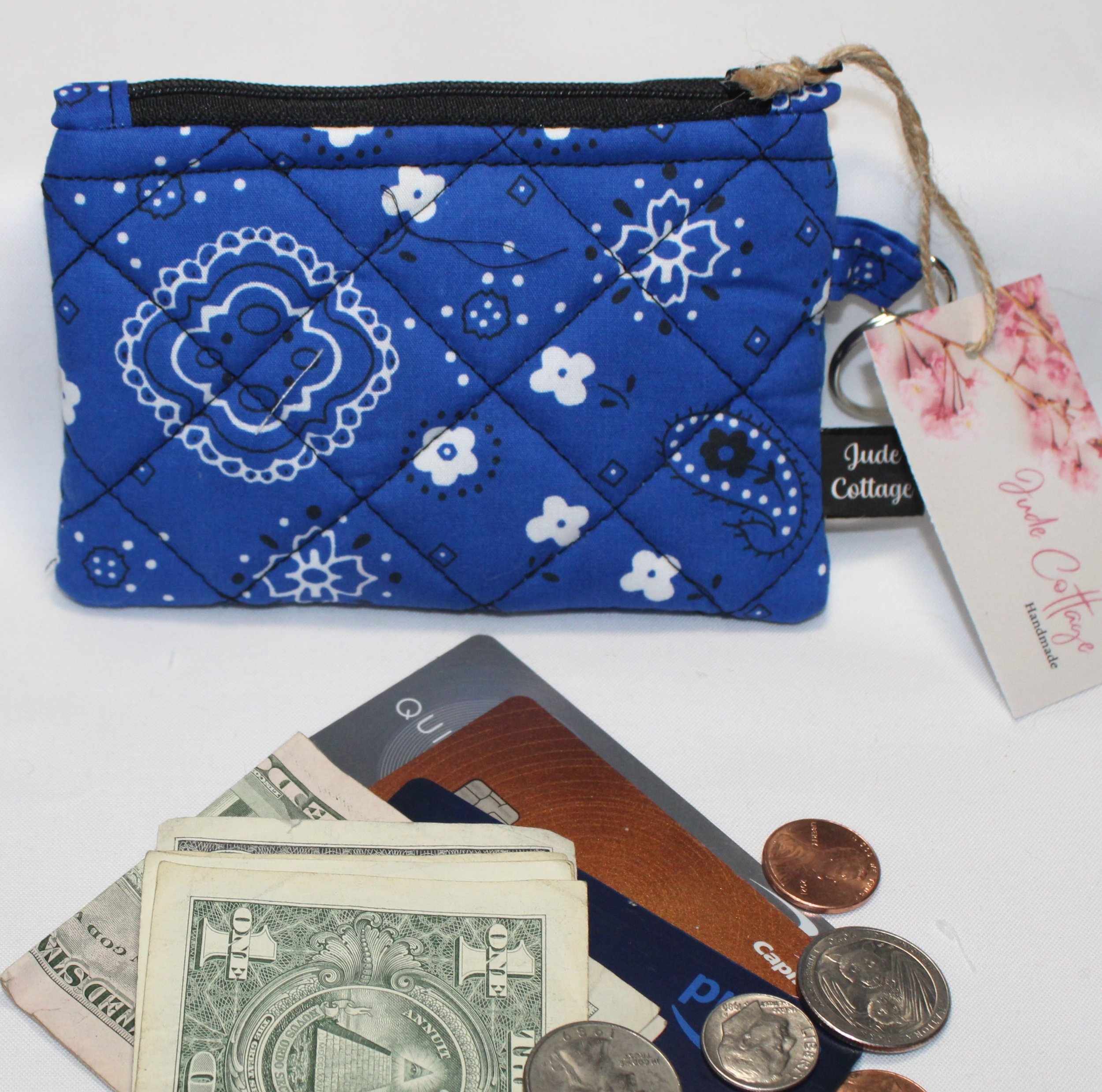 Blue bandana-pattern quilted keychain wallet with zipper closure and metal key ring.