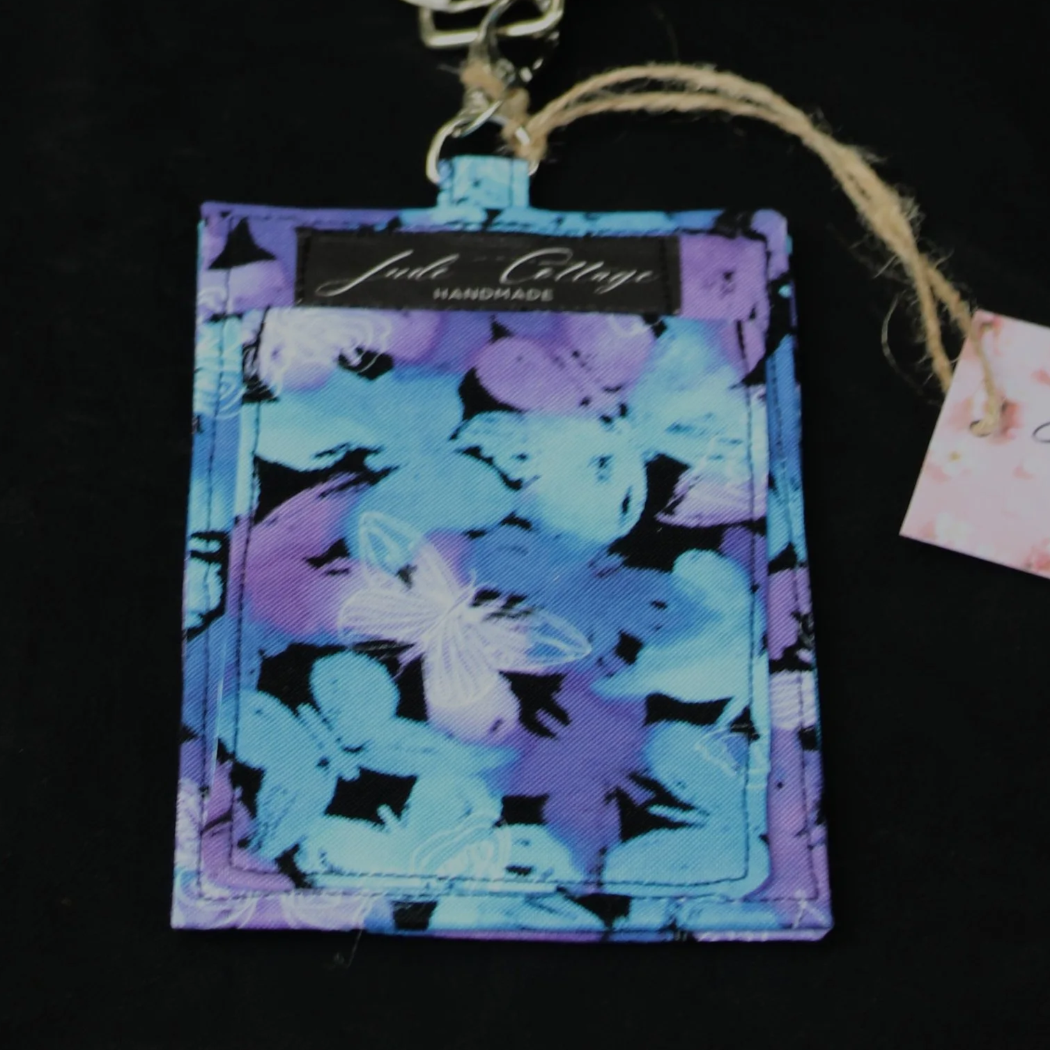 Up-close view of the back side of the Butterfly Mist badge, focusing on the money pocket.