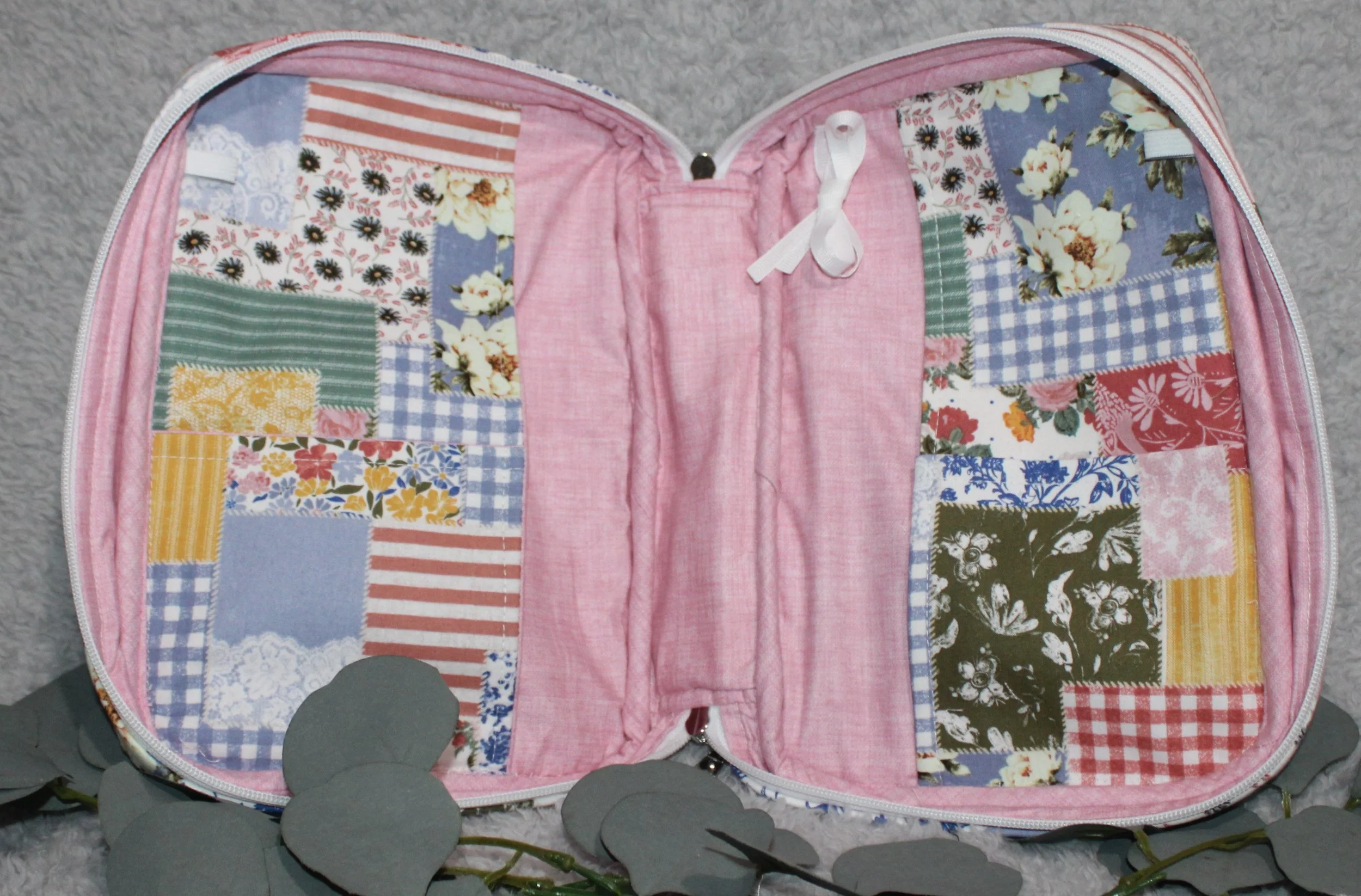 Flat lay of the handcrafted quilted case shown empty, displaying the interior layout with two slip pockets.