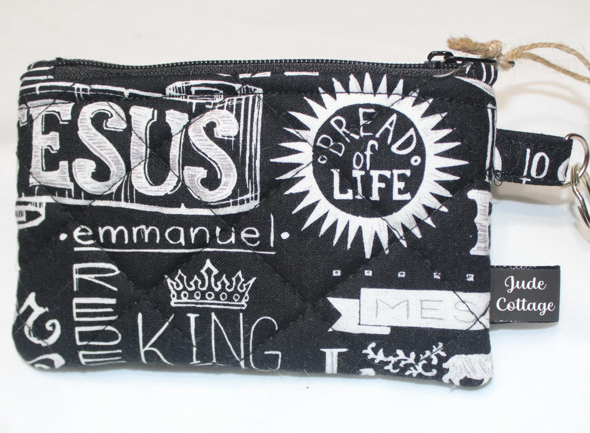 Quilted keychain wallet with King of Kings design, zipper closure, and metal key ring.