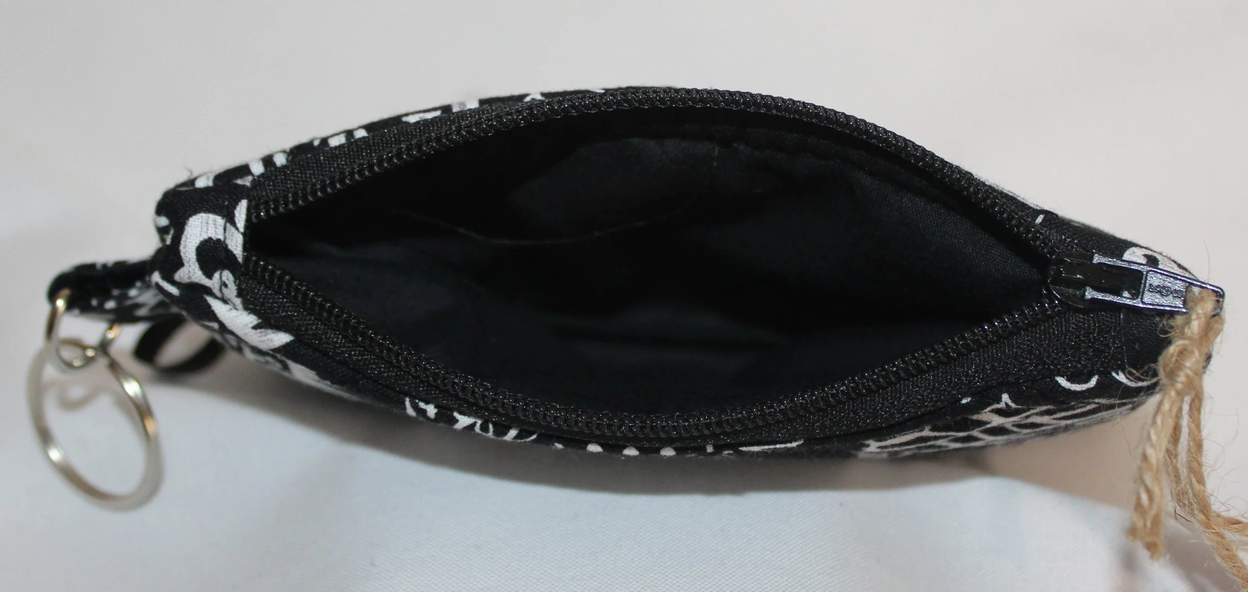 Top view quilted keychain wallet with King of Kings design, zipper closure, and metal key ring.