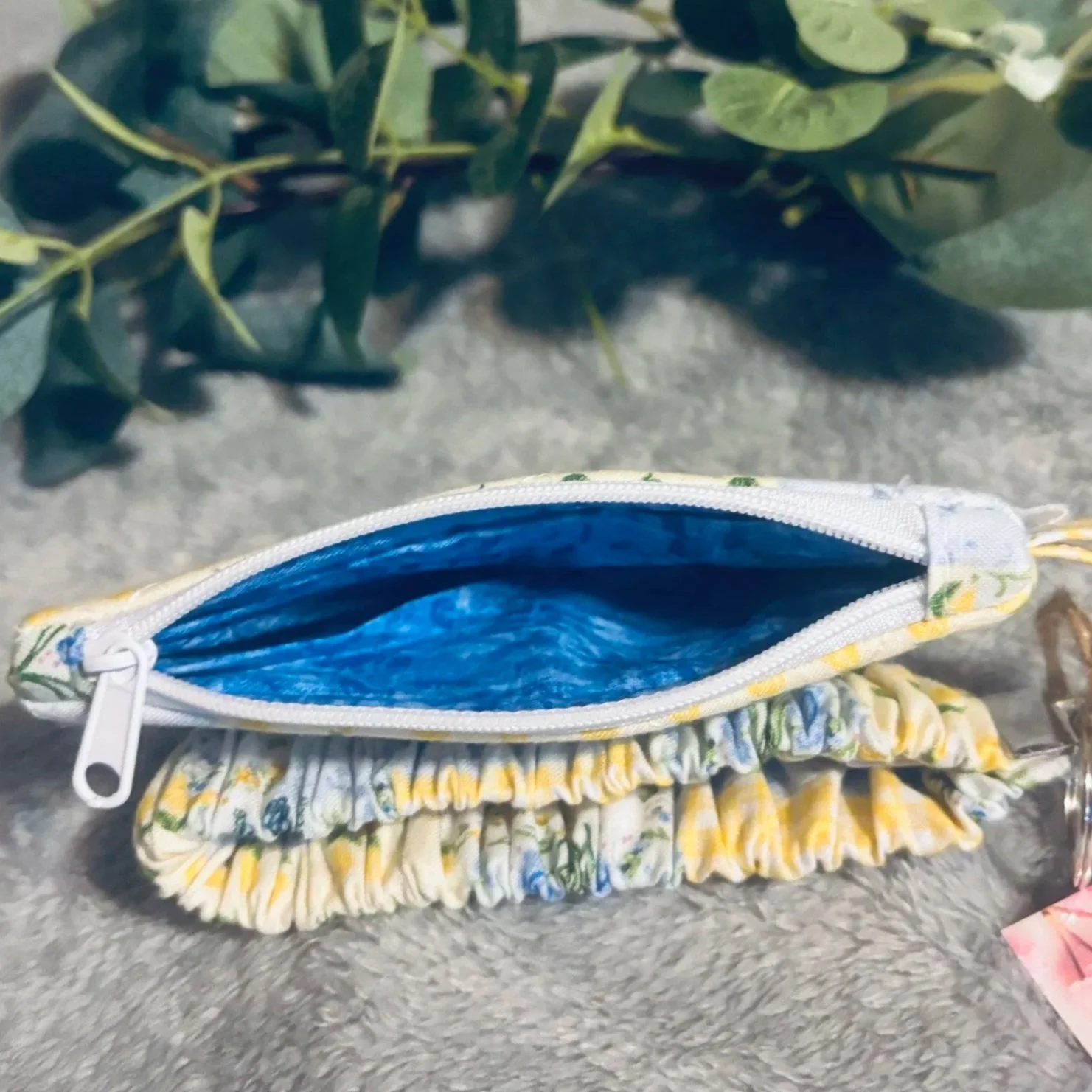 Open view of the Annalee Keychain Wallet showing a blue print interior lining.