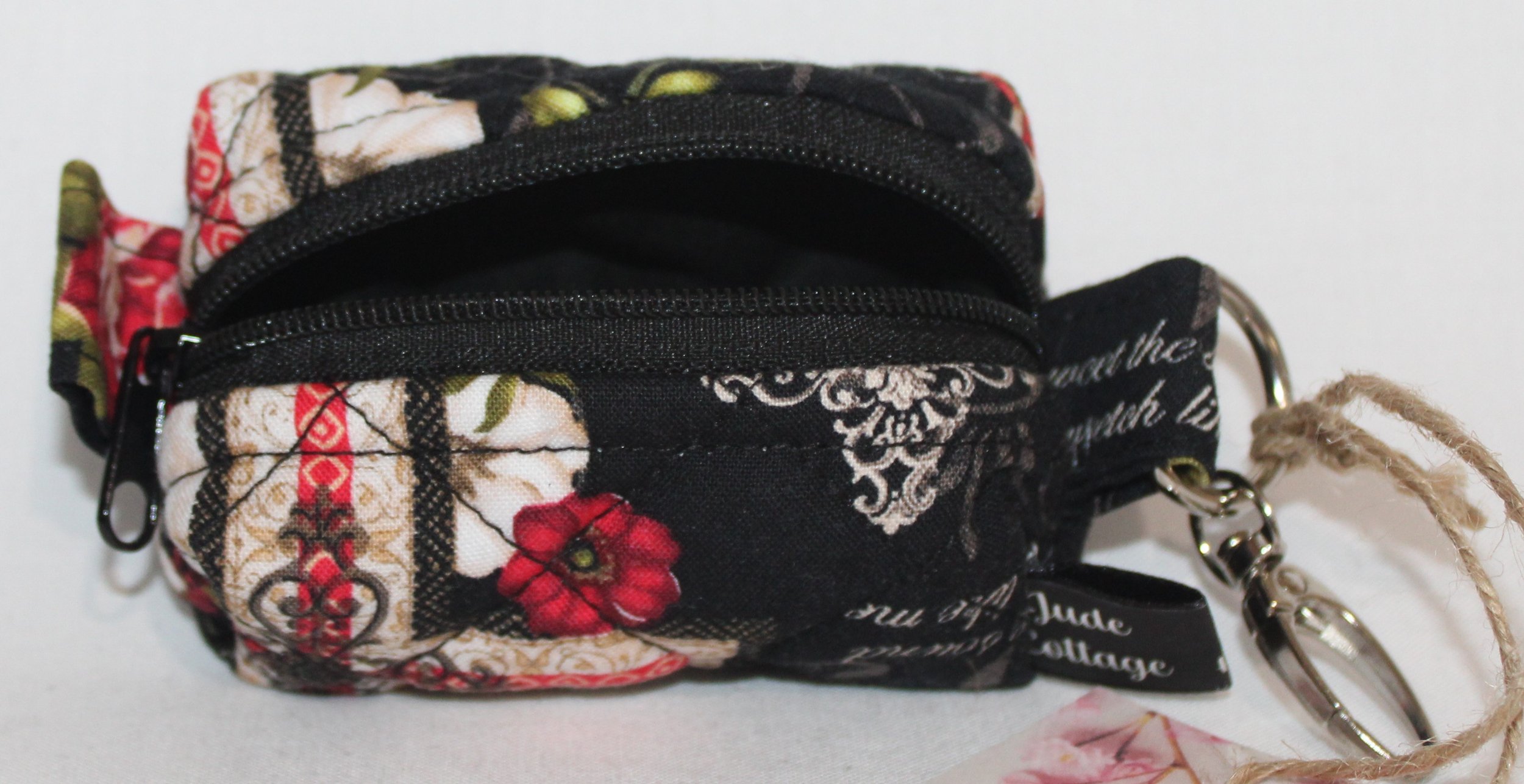 Open top view of the Amazing Grace Bag Charm featuring religious amazing grace print with crosses and showing black lining.