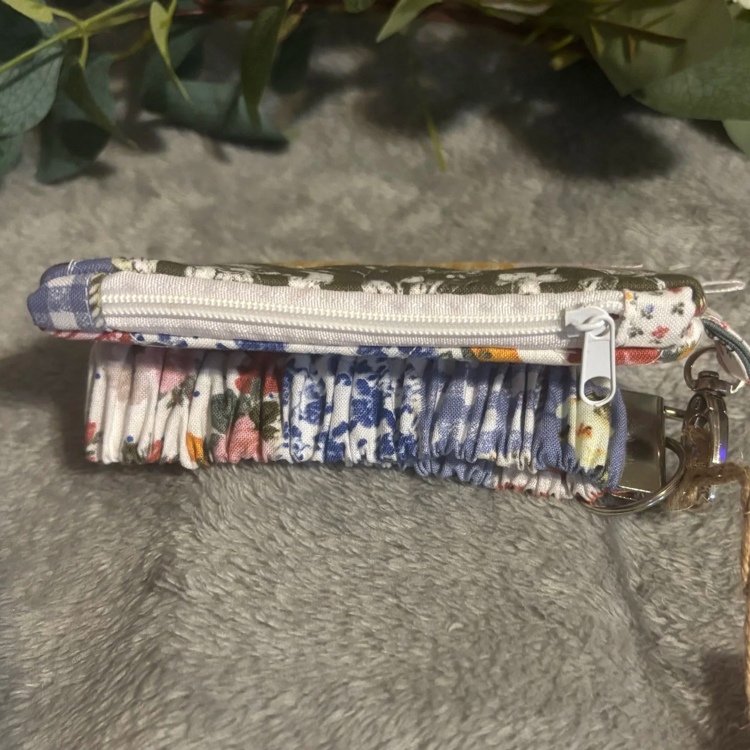 Top closed view of the Serenity Keychain Wallet showing zip closure.