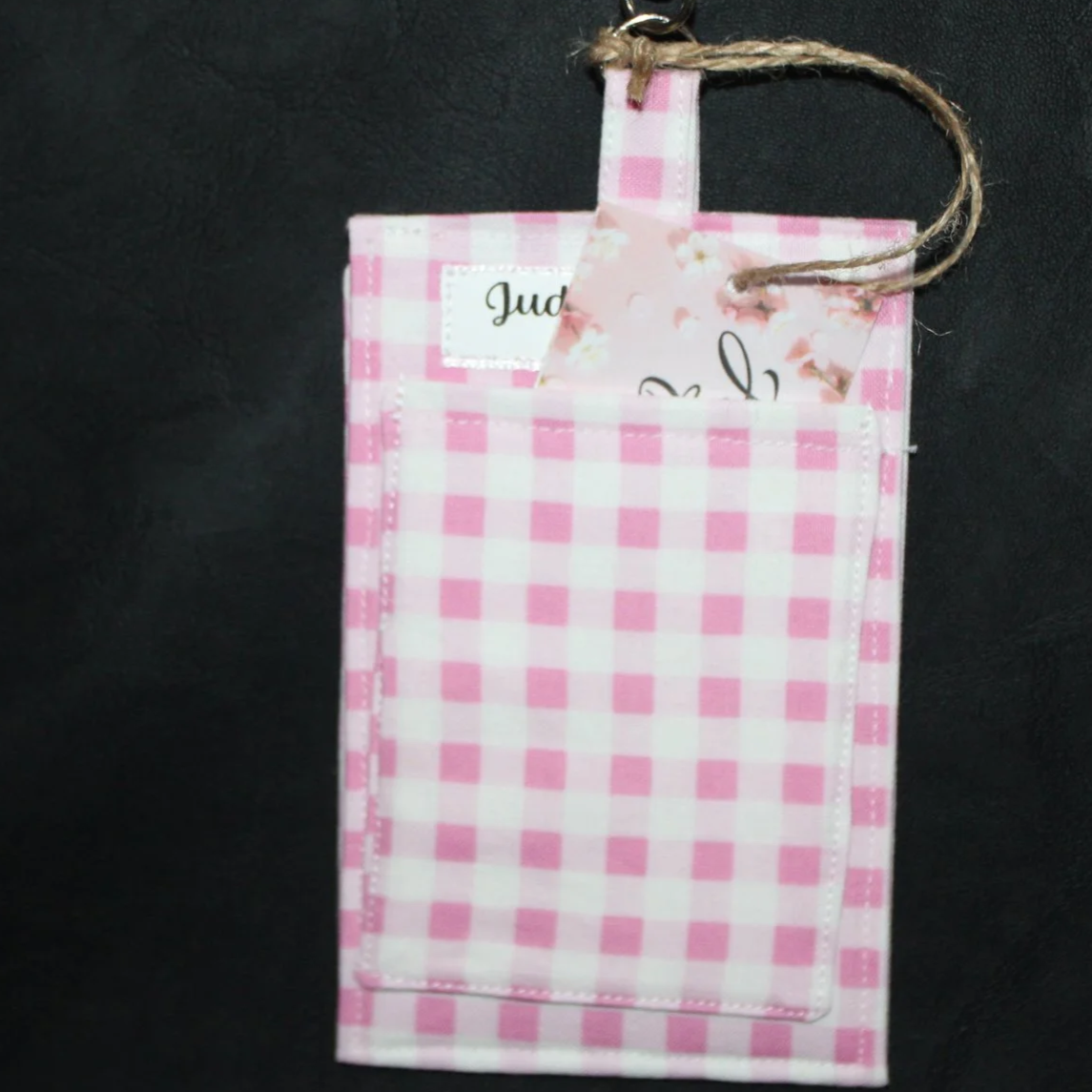 Back up close view of the Annabelle Badge Holder shown with a card partially inserted to illustrate slip pocket.