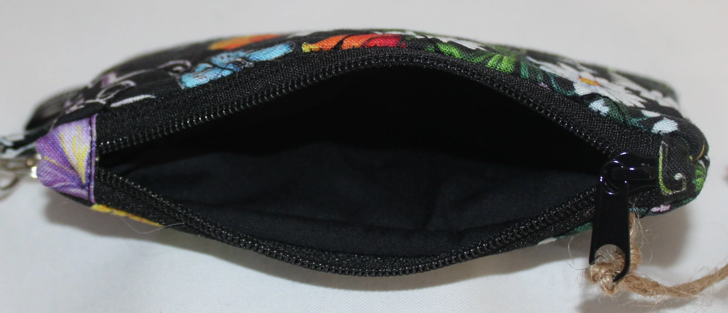 Top view quilted keychain wallet with You Are My Sunshine design, zipper closure, and metal key ring.