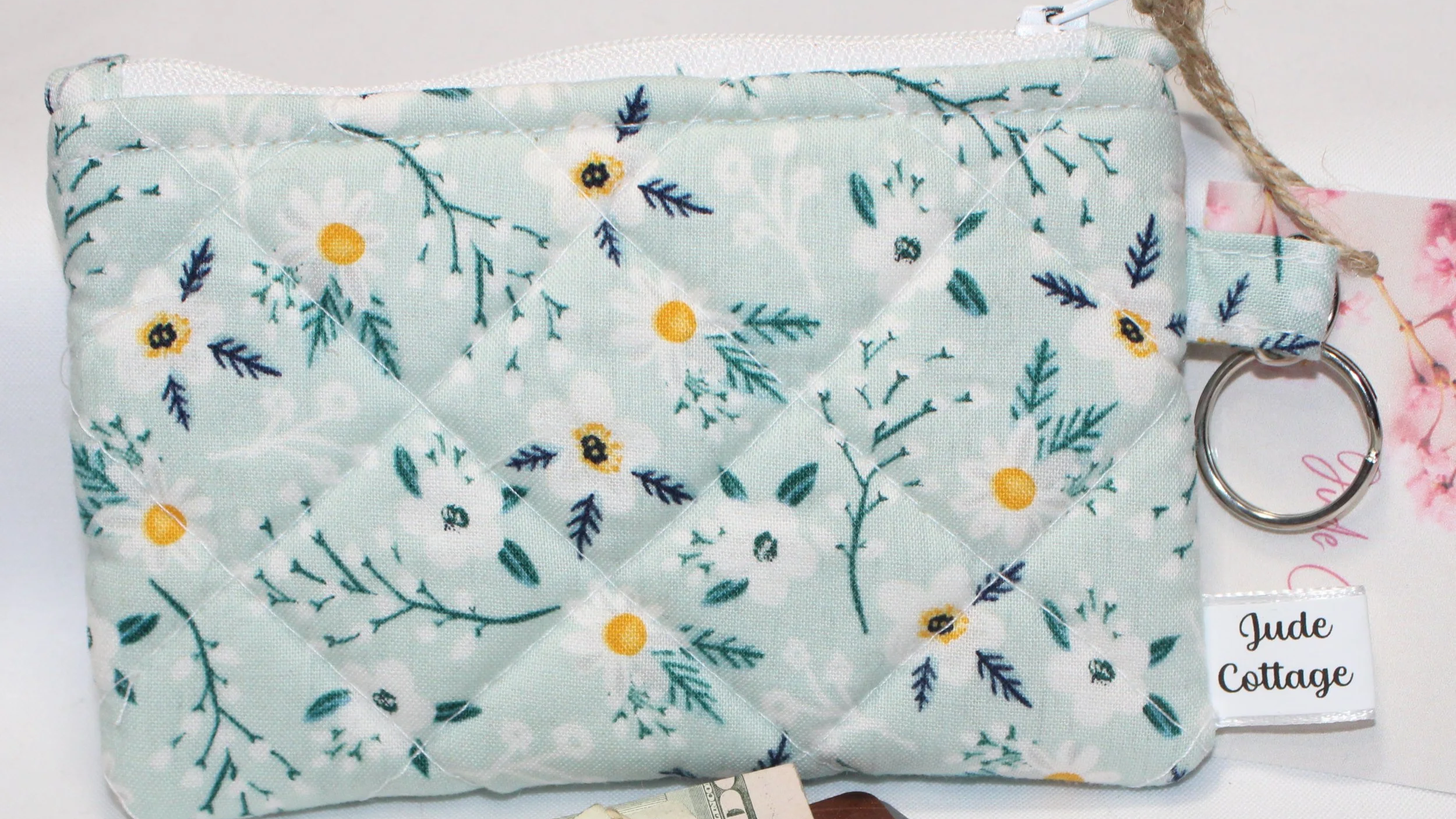 Quilted keychain wallet with Vera pattern, zipper closure, and metal key ring.