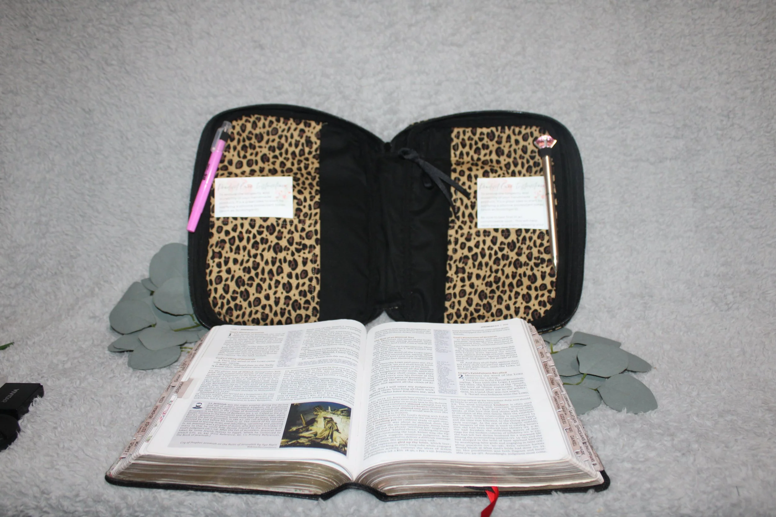 Empty interior view of the Sahara Study Bible Case, showing the neutral lining, interior slip pockets, and pen holders with the case fully open.
