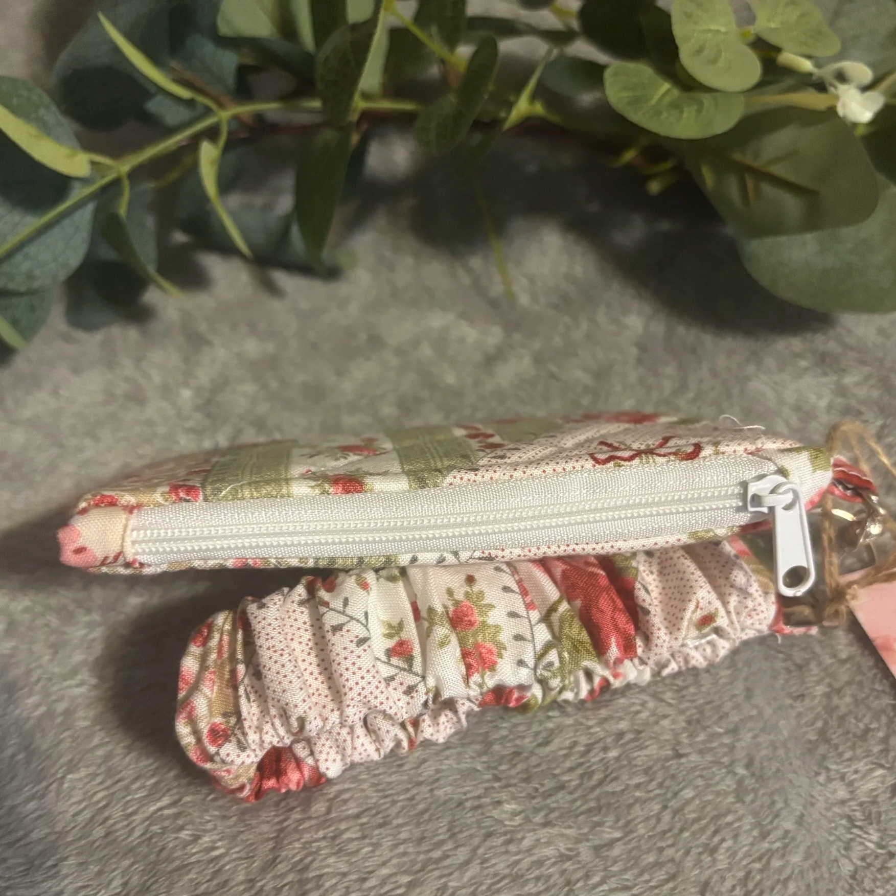 Top closed view of the Charity Keychain Wallet showing zip closure.