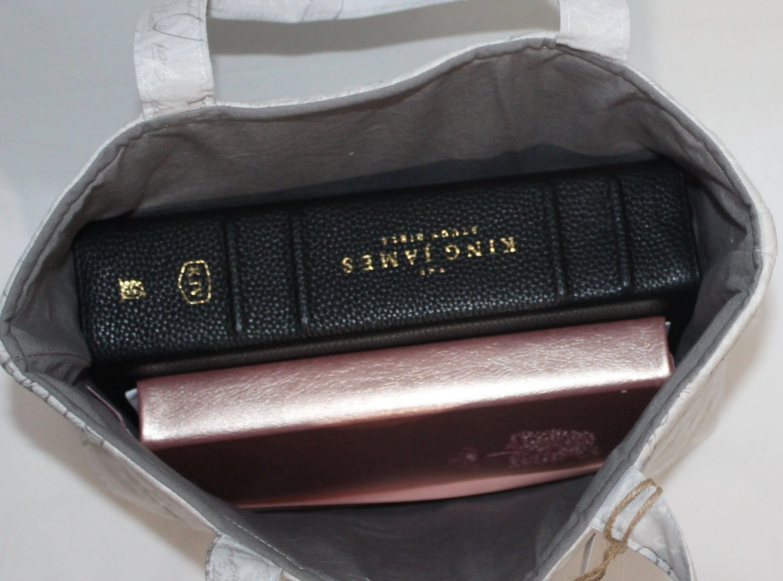 Top view of Faith Hope Love Bible sleeve with a study Bible and notebook inserted.