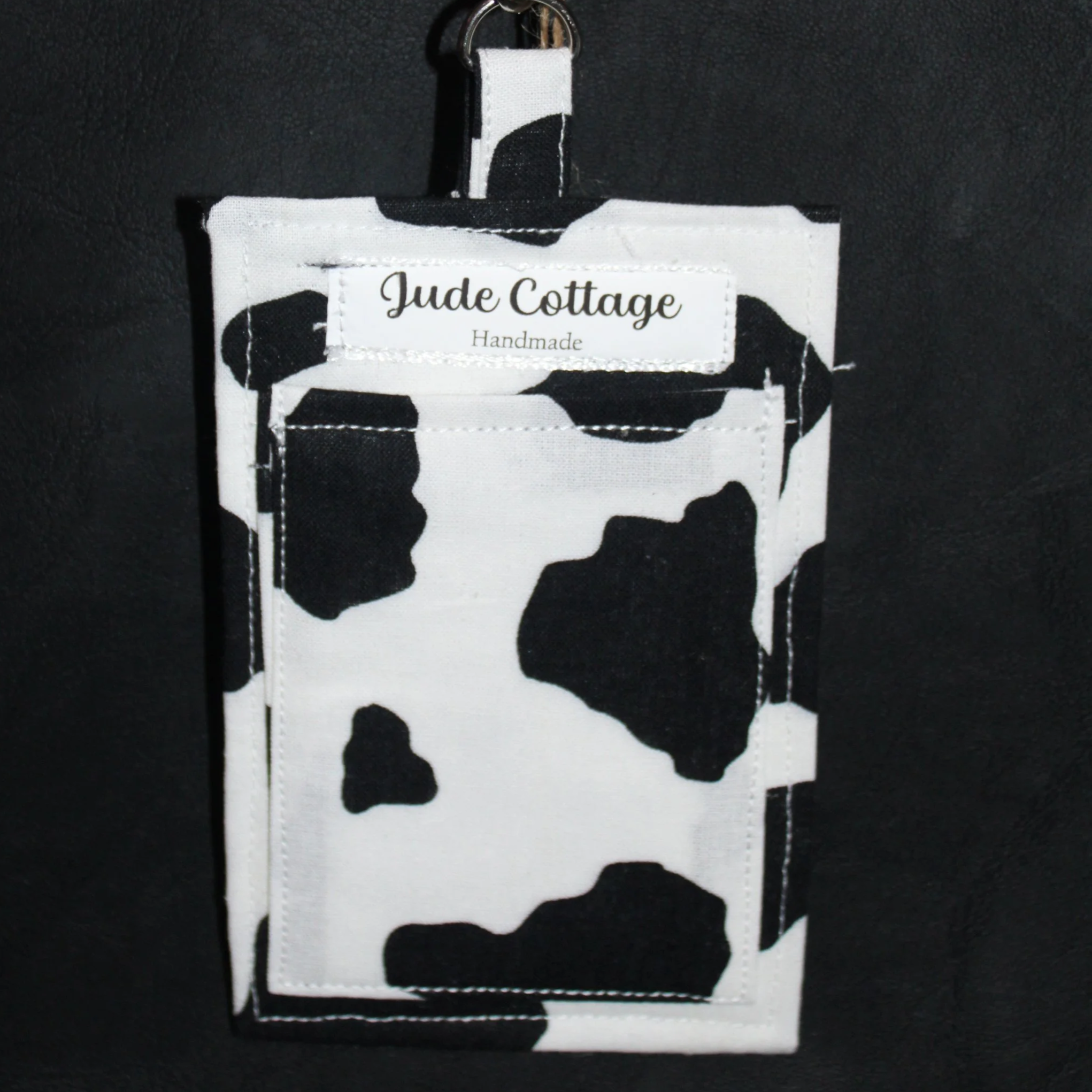 Back empty view of the Black Cow Badge Holder showing the slip pocket for cash, cards, or other essentials.