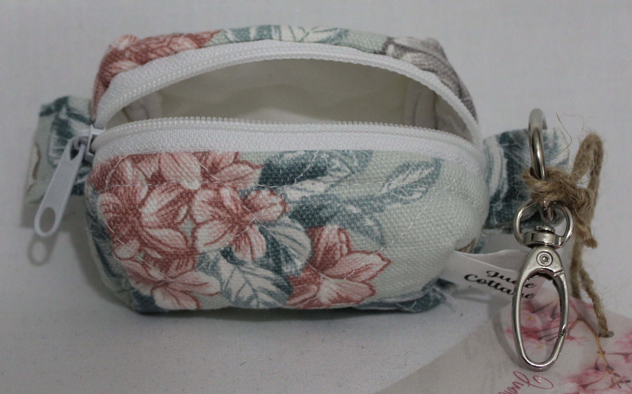 Open top view of the Joelle Bag Charm showing zip enclosure and white lining.