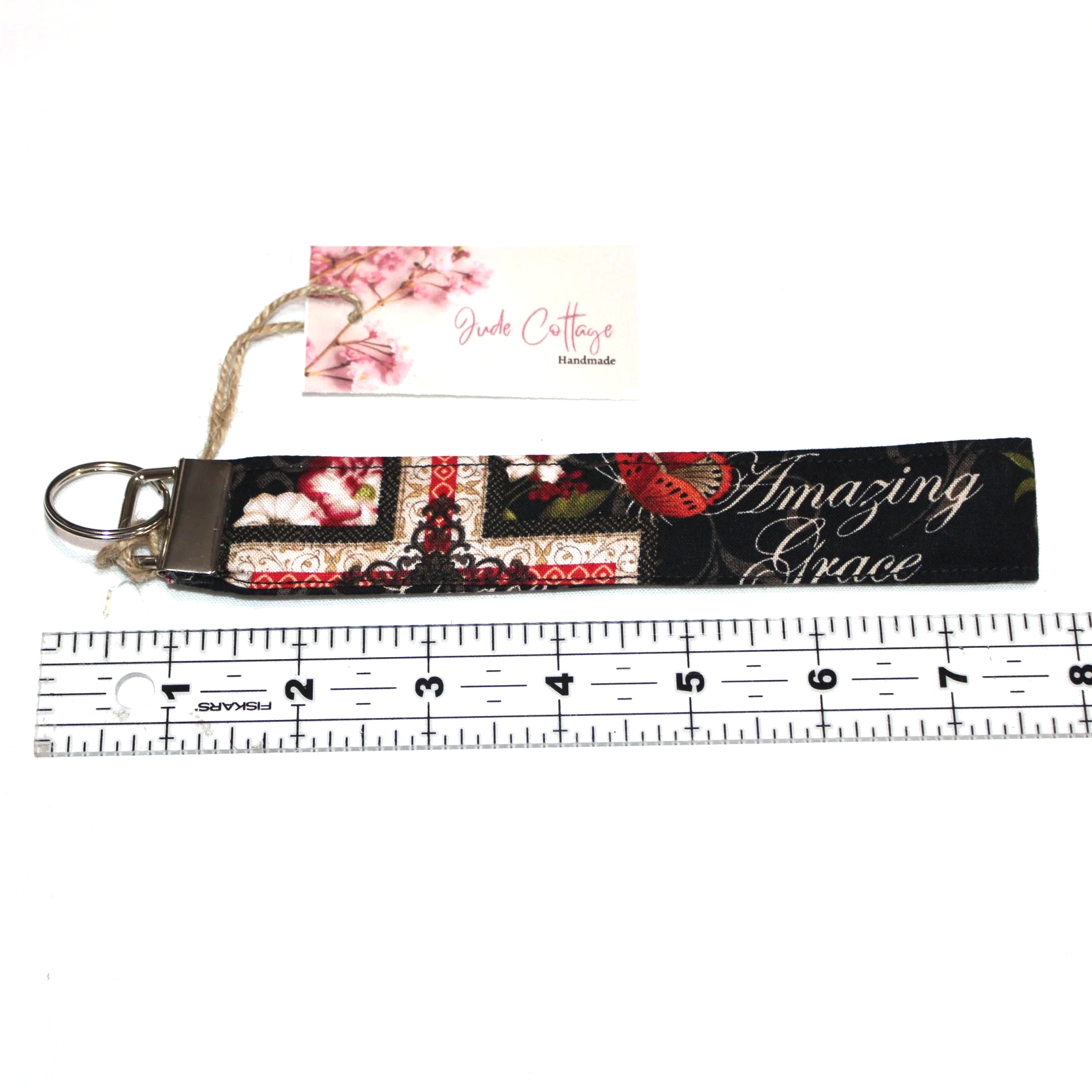The Amazing Grace Wristlet shown above a ruler to demonstrate size.