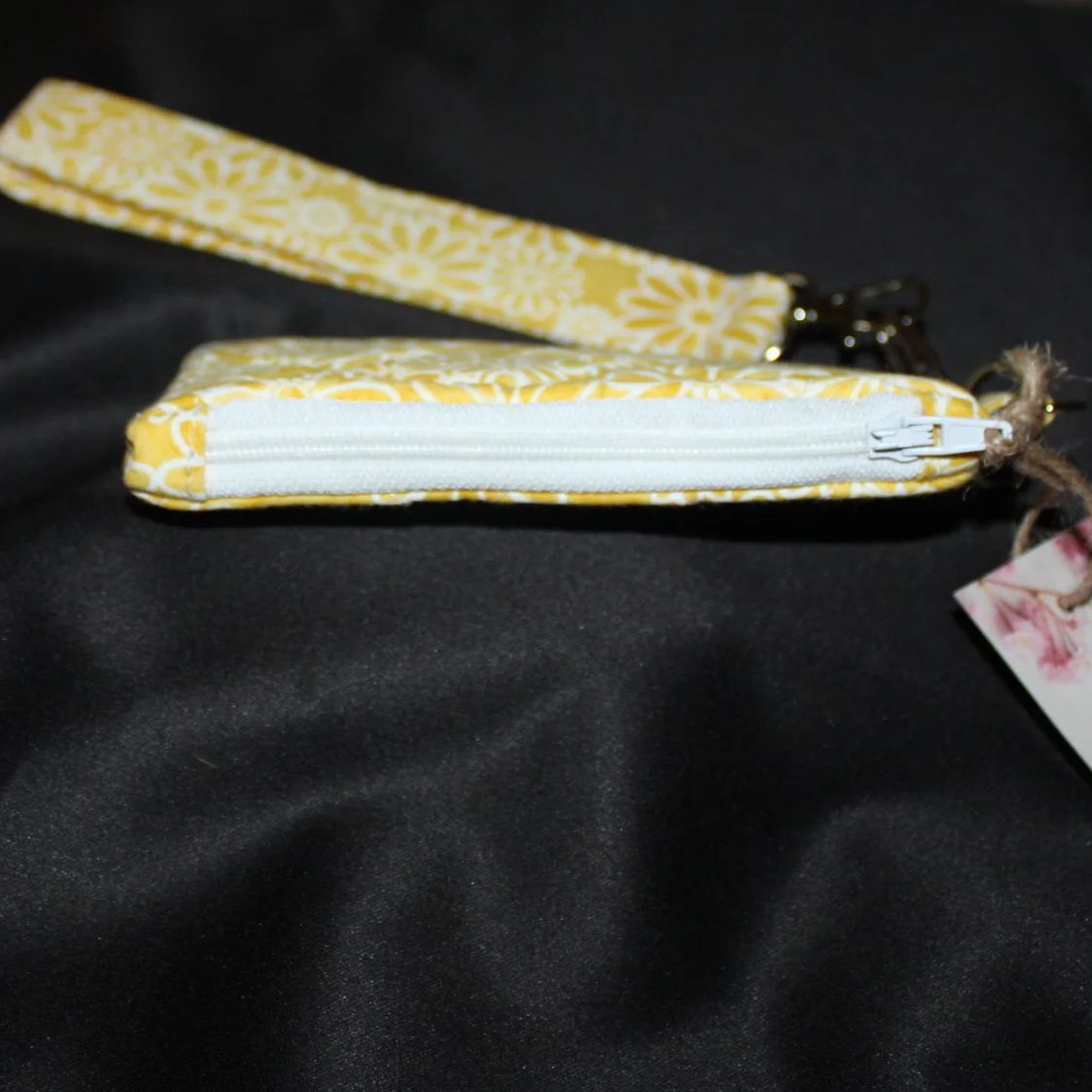 Top closed view of the Gold Daisy Wallet showing zip closure.