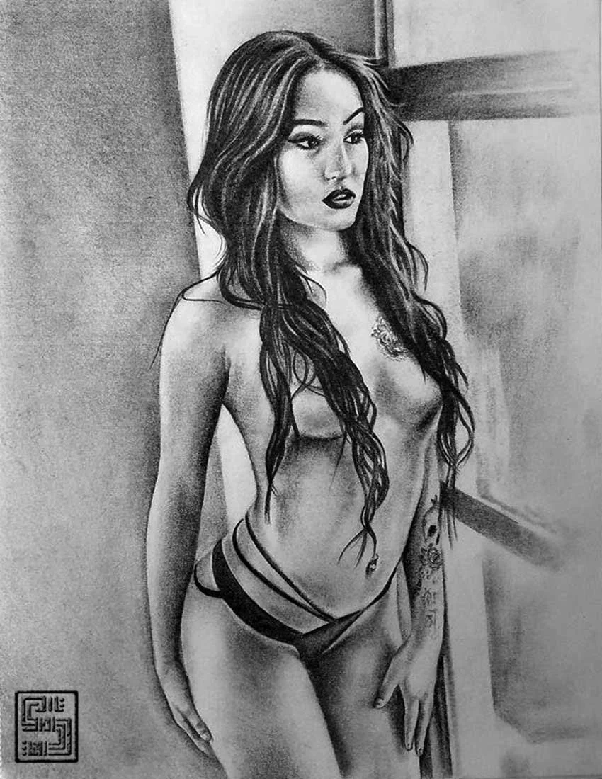 A black and white realistic pencil drawing of a woman with long wavy hair, wearing dark lipstick, standing topless with a tattoo on her side, in front of a plain background.