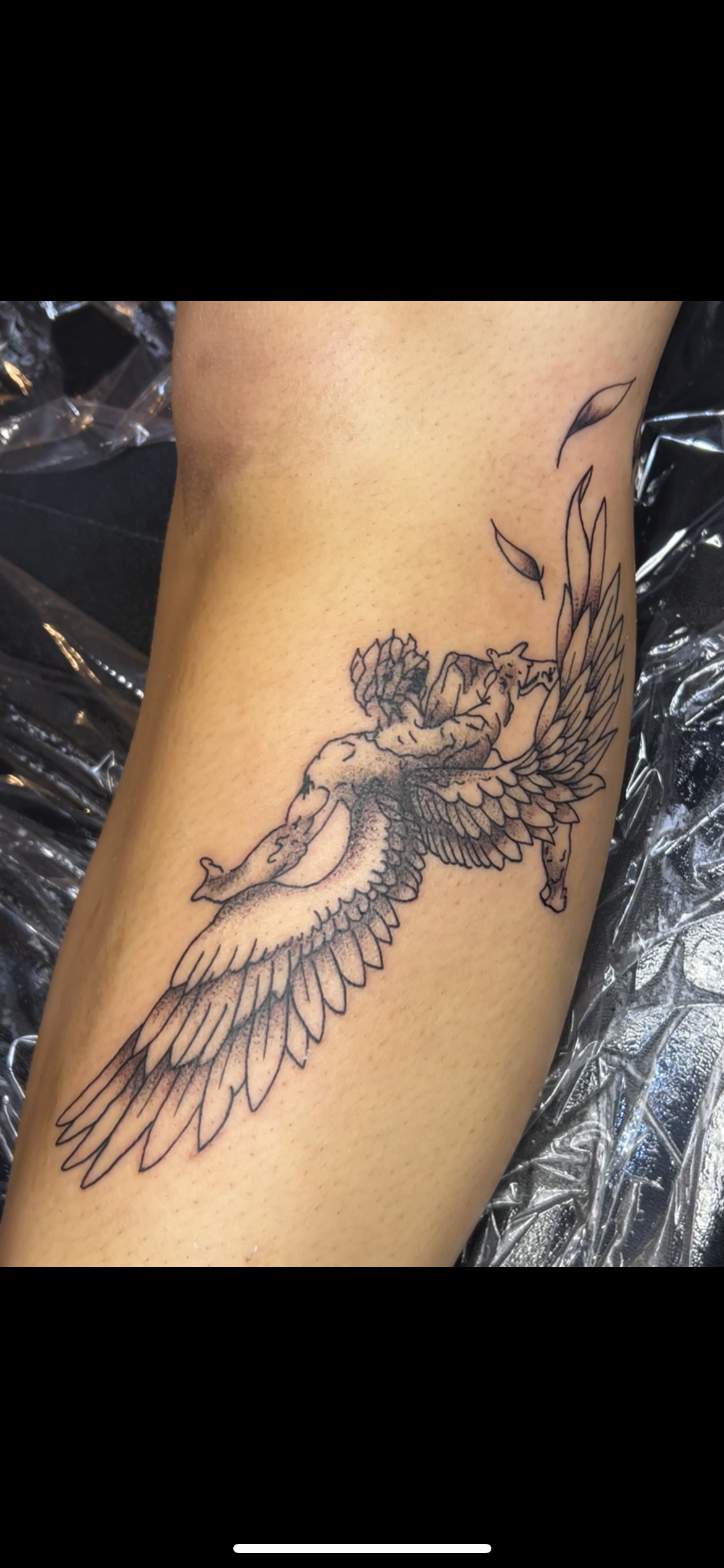 Line art tattoo of a woman riding a winged horse with leaves falling around.