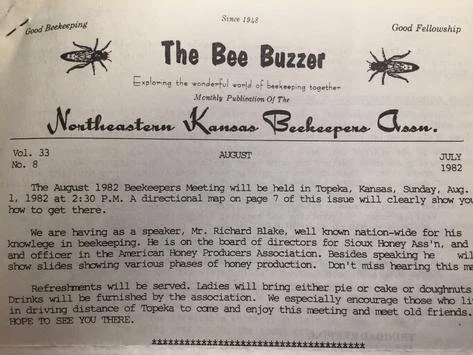 A newsletter titled "The Bee Buzzar" from August 1982, published by the Northeastern Kansas Beekeepers Assn., with articles about beekeeping meetings and honey production.