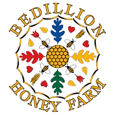 Logo for Bedillion Honey Farm featuring a honeycomb surrounded by colorful leaves and hearts