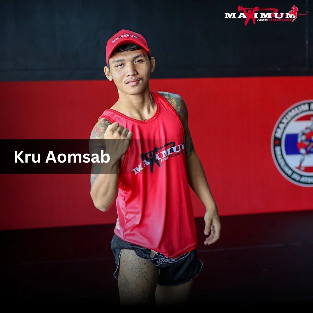A young man in red sportswear and a red cap standing in a gym, showing a fist gesture, with a black and red background and a gym logo.